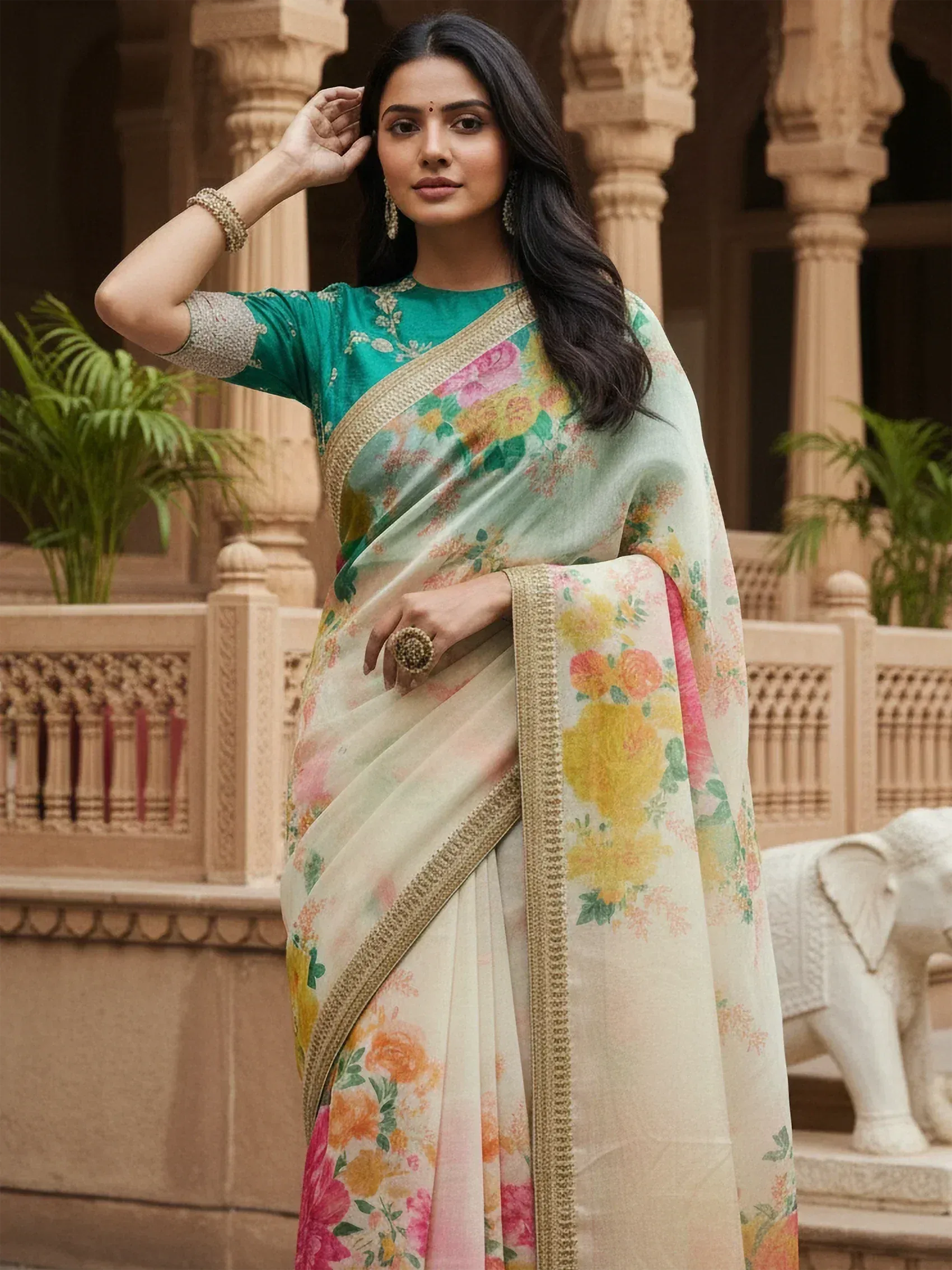 Woman in floral print saree with gold border, Indian ethnic wear, designer saree for festive occasions