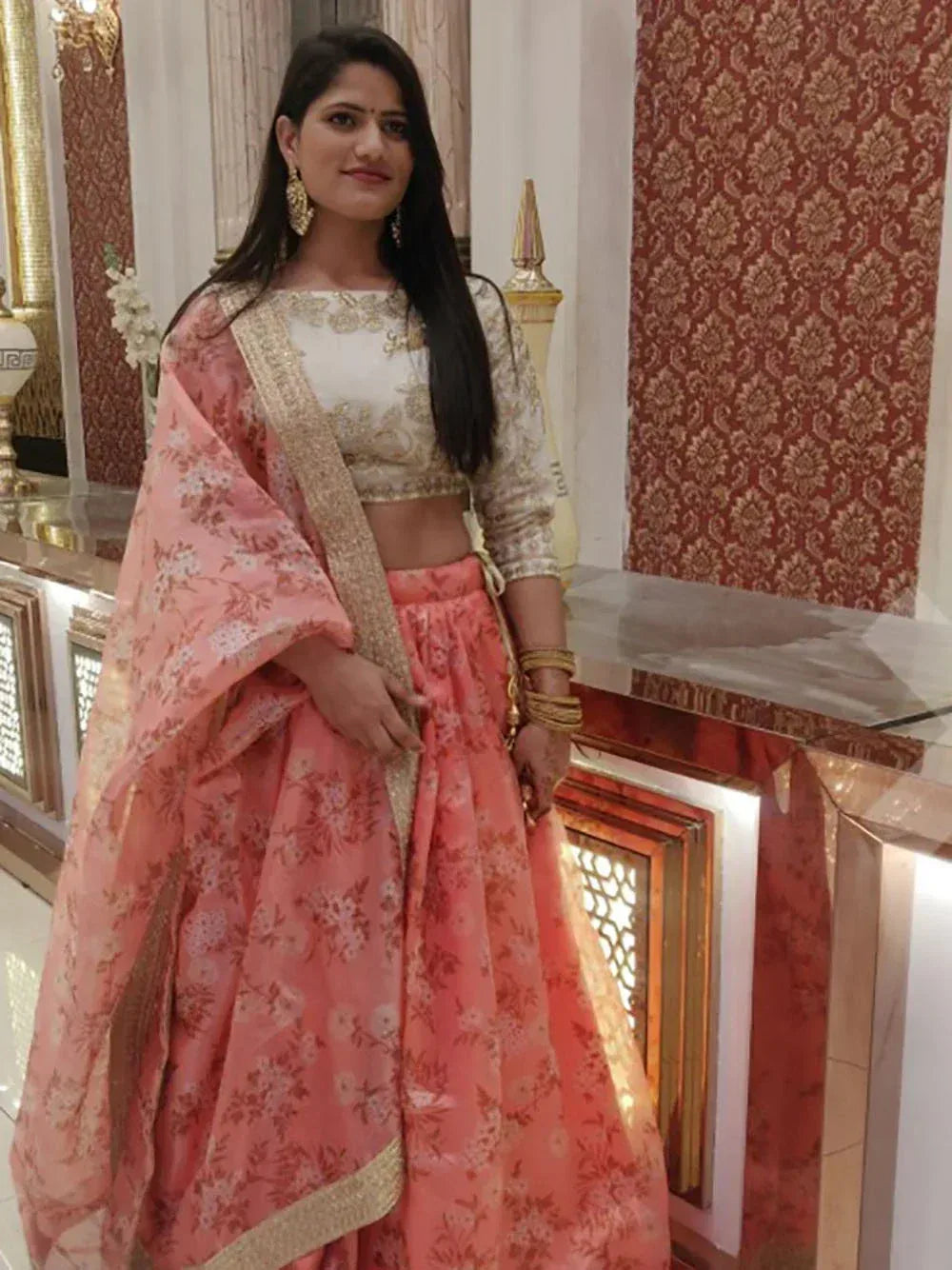 Pink floral lehenga choli with gold embroidery, perfect for Indian weddings and festive occasions