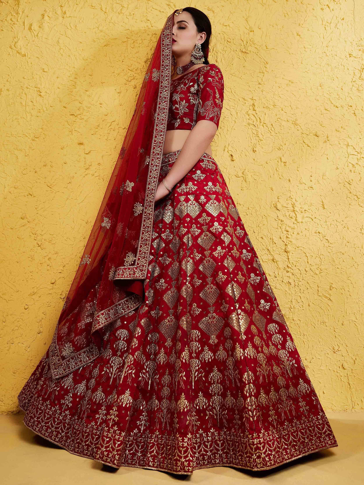 Red and gold embroidered lehenga choli with matching dupatta, perfect for Indian ethnic wear