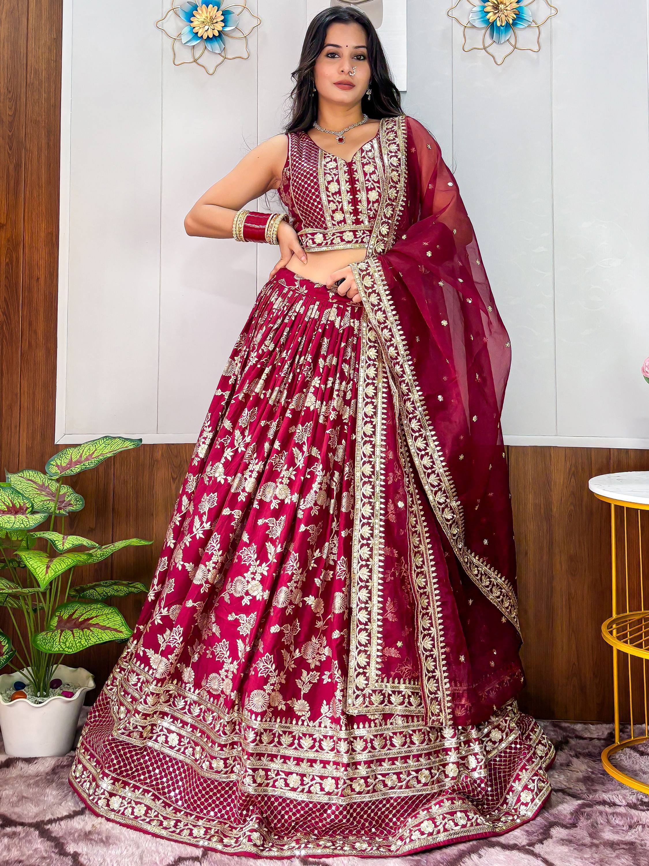 Maroon designer lehenga choli with gold embroidery, perfect for Indian weddings and festive occasions