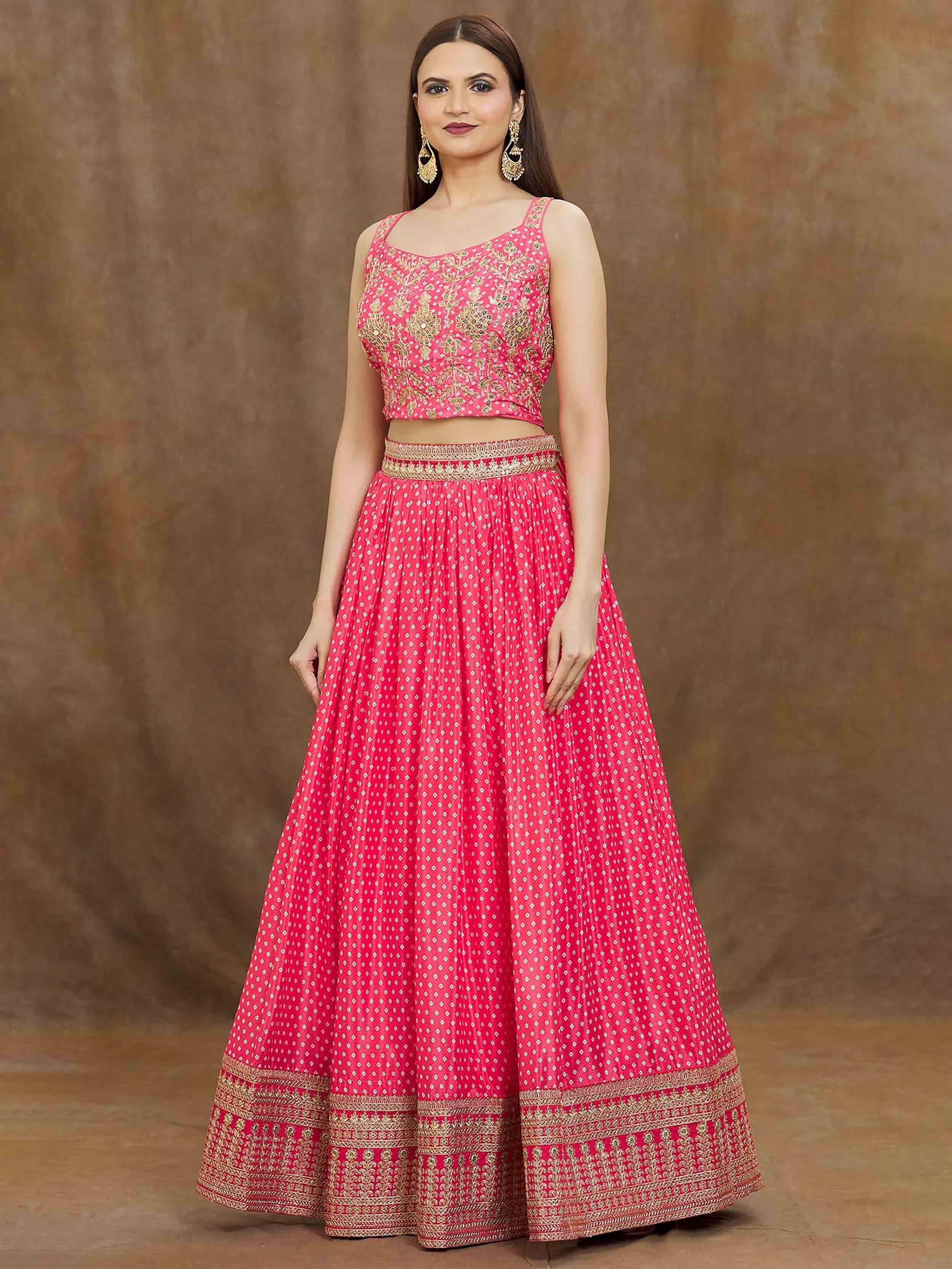 Pink embroidered lehenga choli with gold detailing, perfect for Indian ethnic wear