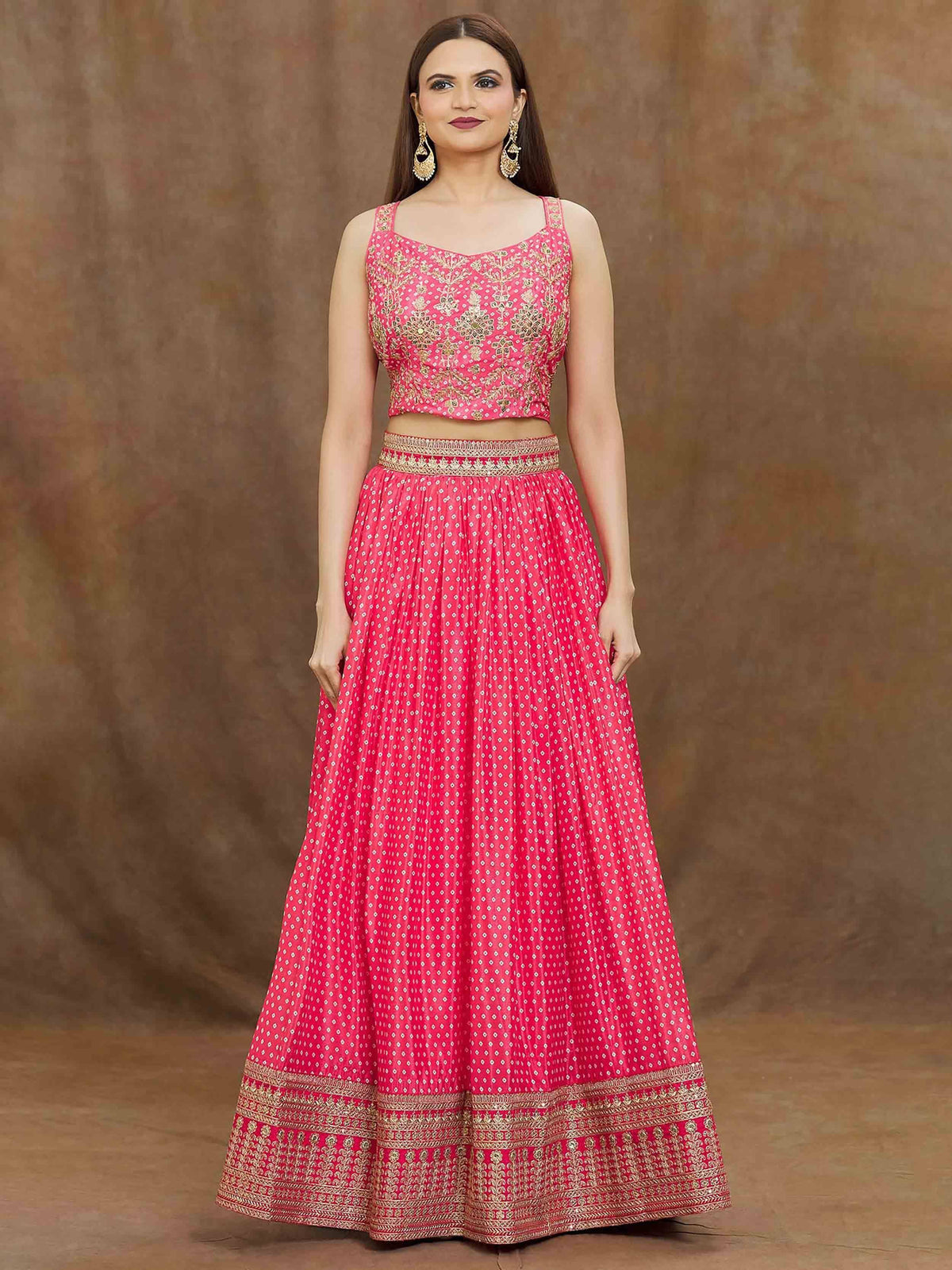 Pink embroidered lehenga choli with gold detailing, perfect for Indian ethnic wear