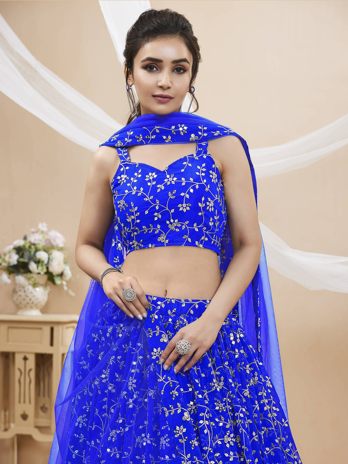 Royal blue embroidered lehenga choli with floral gold thread work, perfect for Indian ethnic wear occasions.