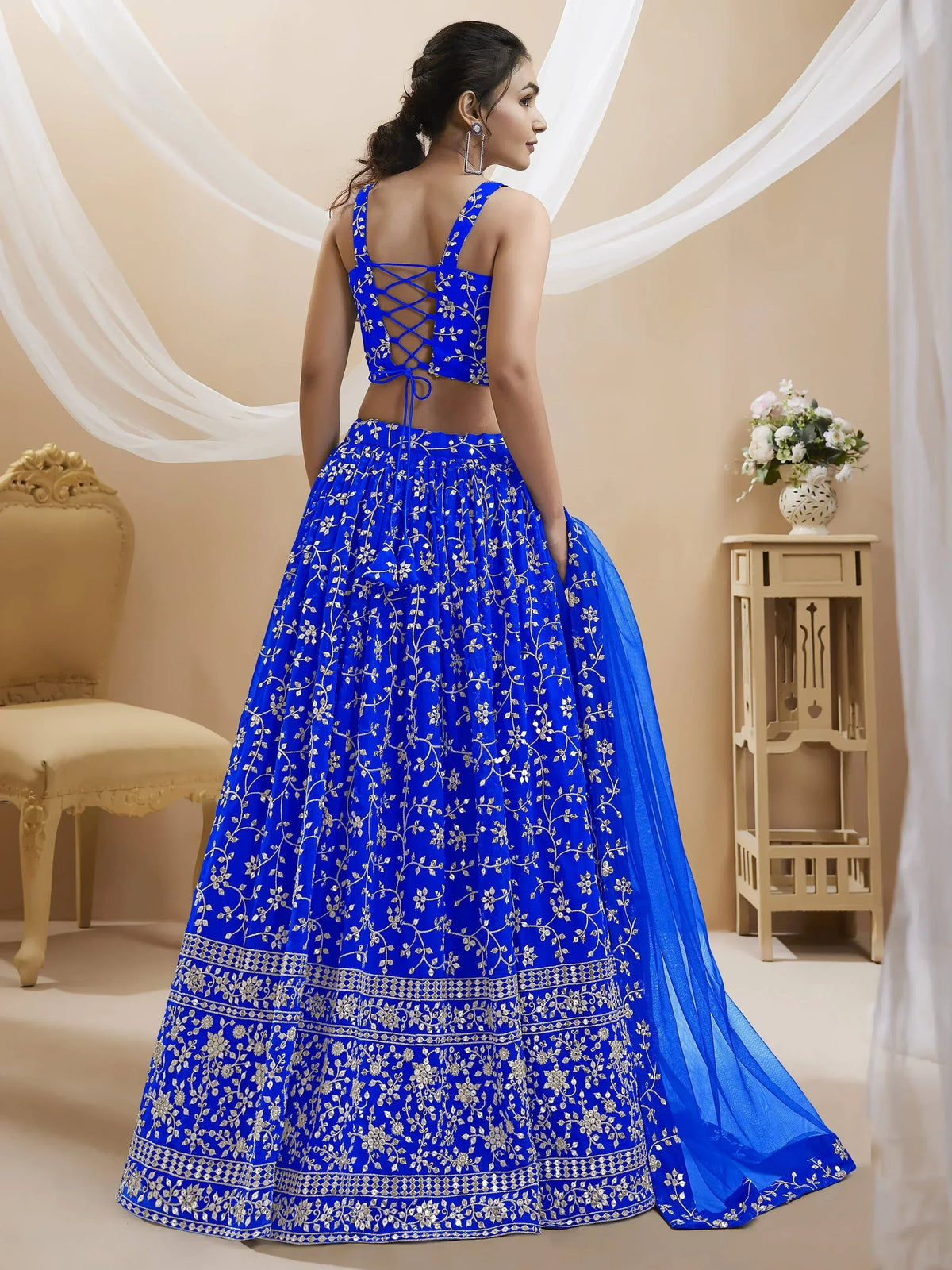 Royal blue embroidered lehenga choli with lace-up back and floral motifs