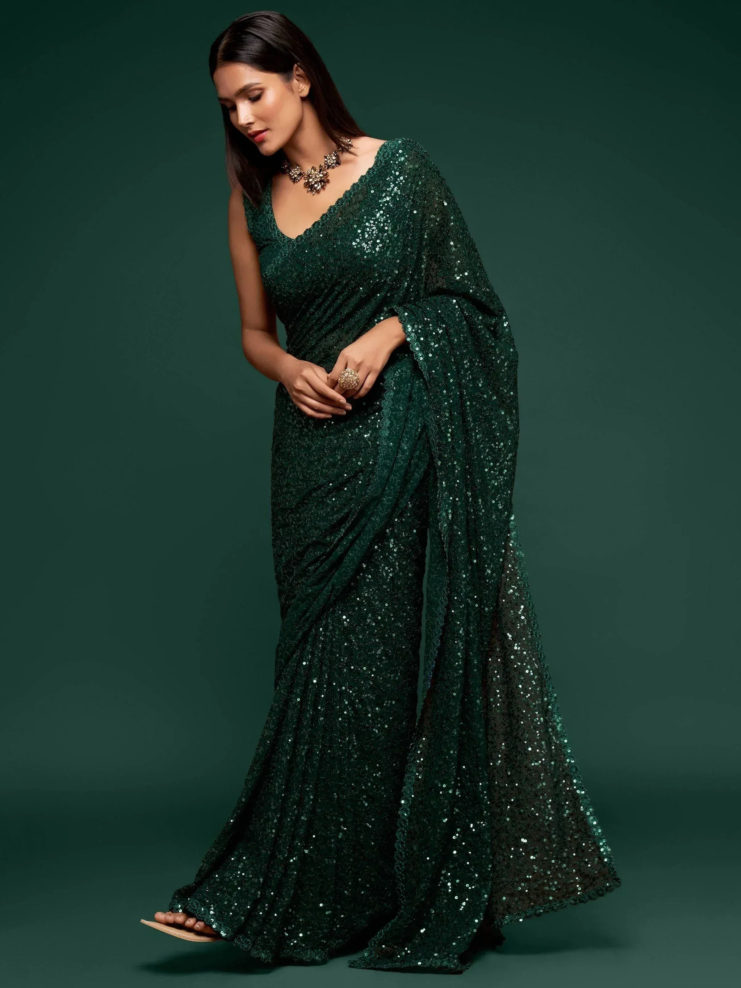 Emerald green sequin saree with V-neck blouse, perfect for Indian ethnic events and weddings