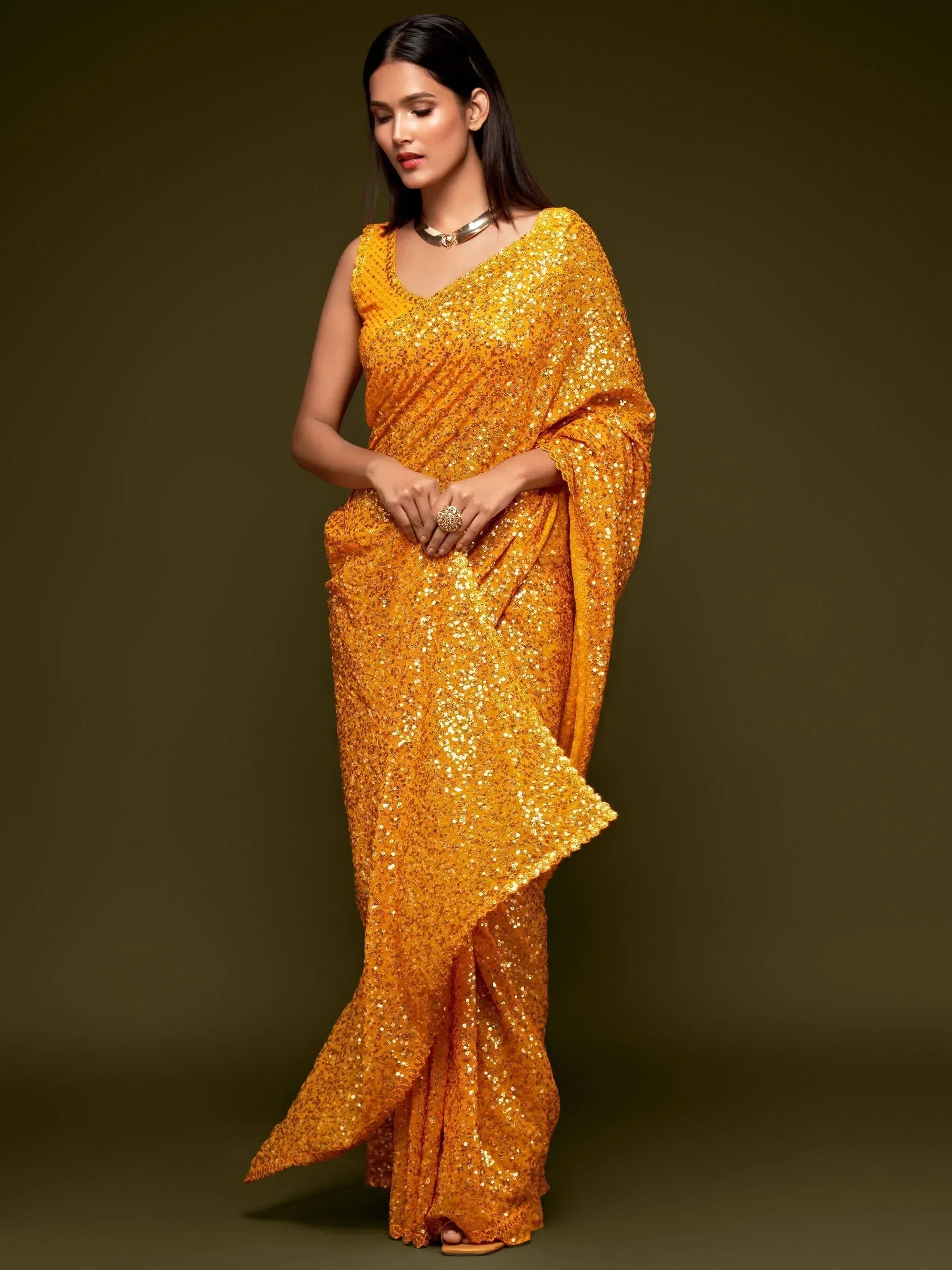 Golden sequin saree with V-neck blouse, perfect for Indian ethnic wear and festive occasions