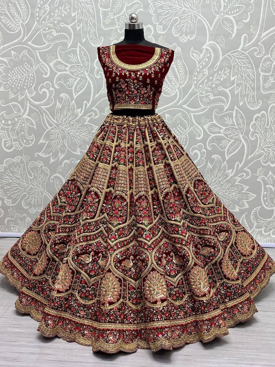 Maroon designer lehenga choli with gold embroidery and peacock motifs, perfect for weddings and festivals