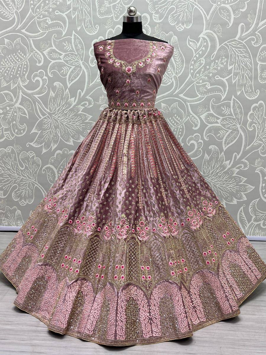 Pink velvet lehenga choli with floral embroidery and gold detailing, perfect for Indian ethnic wear occasions