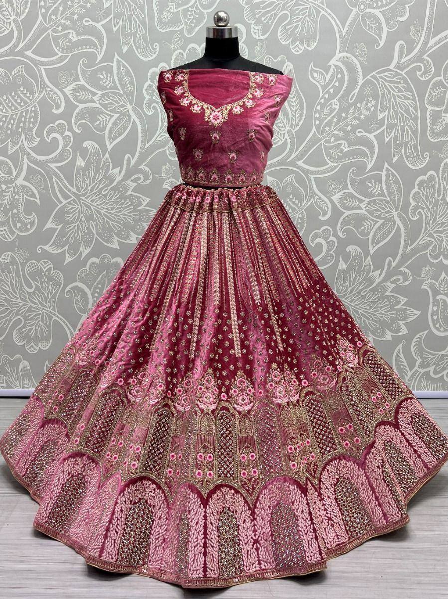 Pink velvet designer lehenga choli with gold embroidery, perfect for Indian weddings and festive occasions
