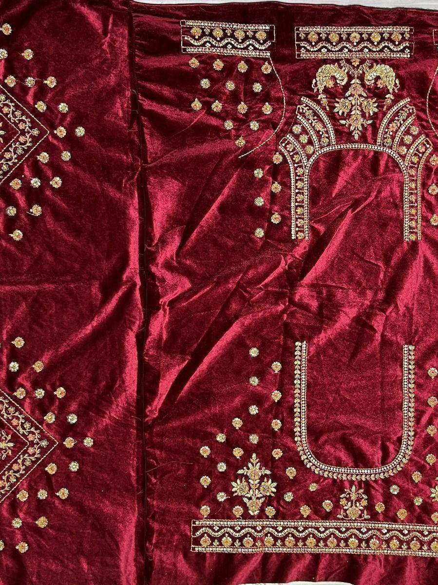 Rich maroon velvet ethnic wear with gold embroidery, perfect for Indian designer lehenga or saree