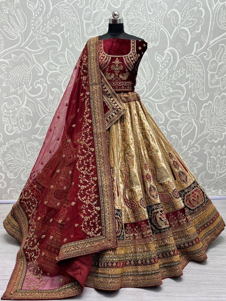 Maroon and gold designer lehenga choli with heavy embroidery and dupatta, perfect for weddings and festivals