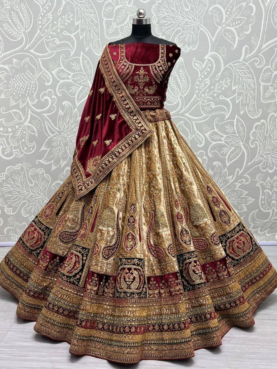 Maroon and gold designer lehenga choli with intricate embroidery and velvet dupatta, perfect for weddings