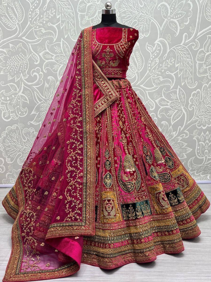 Fuchsia velvet lehenga choli with gold embroidery, designer Indian ethnic wear for weddings