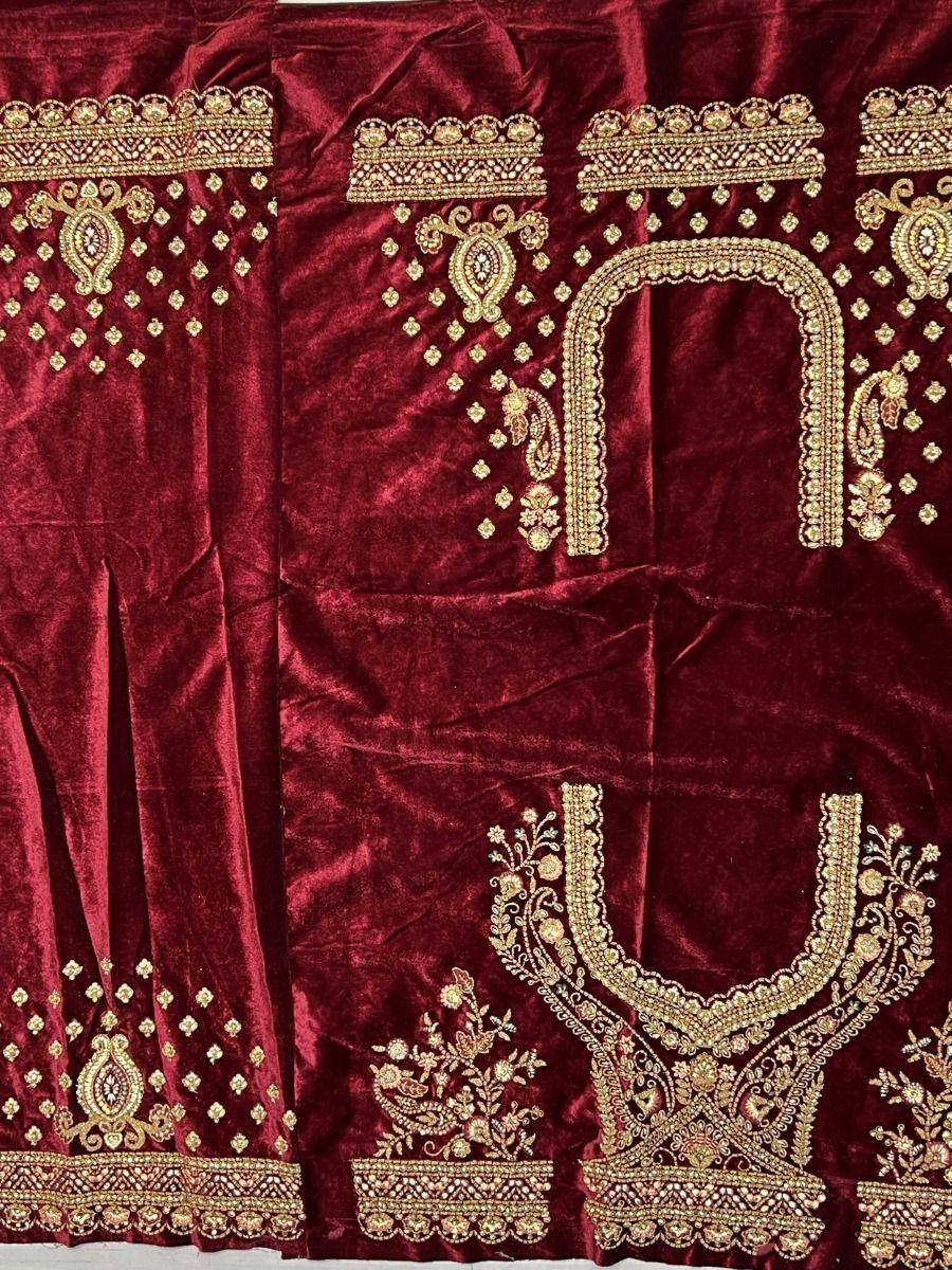Rich maroon velvet ethnic wear with gold embroidery, perfect for designer lehenga or saree