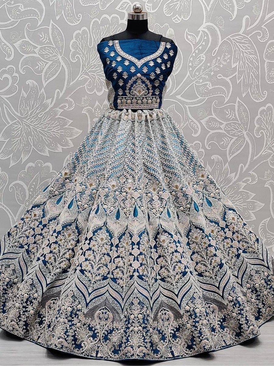 Blue and silver embroidered lehenga choli with intricate floral patterns, perfect for Indian ethnic wear