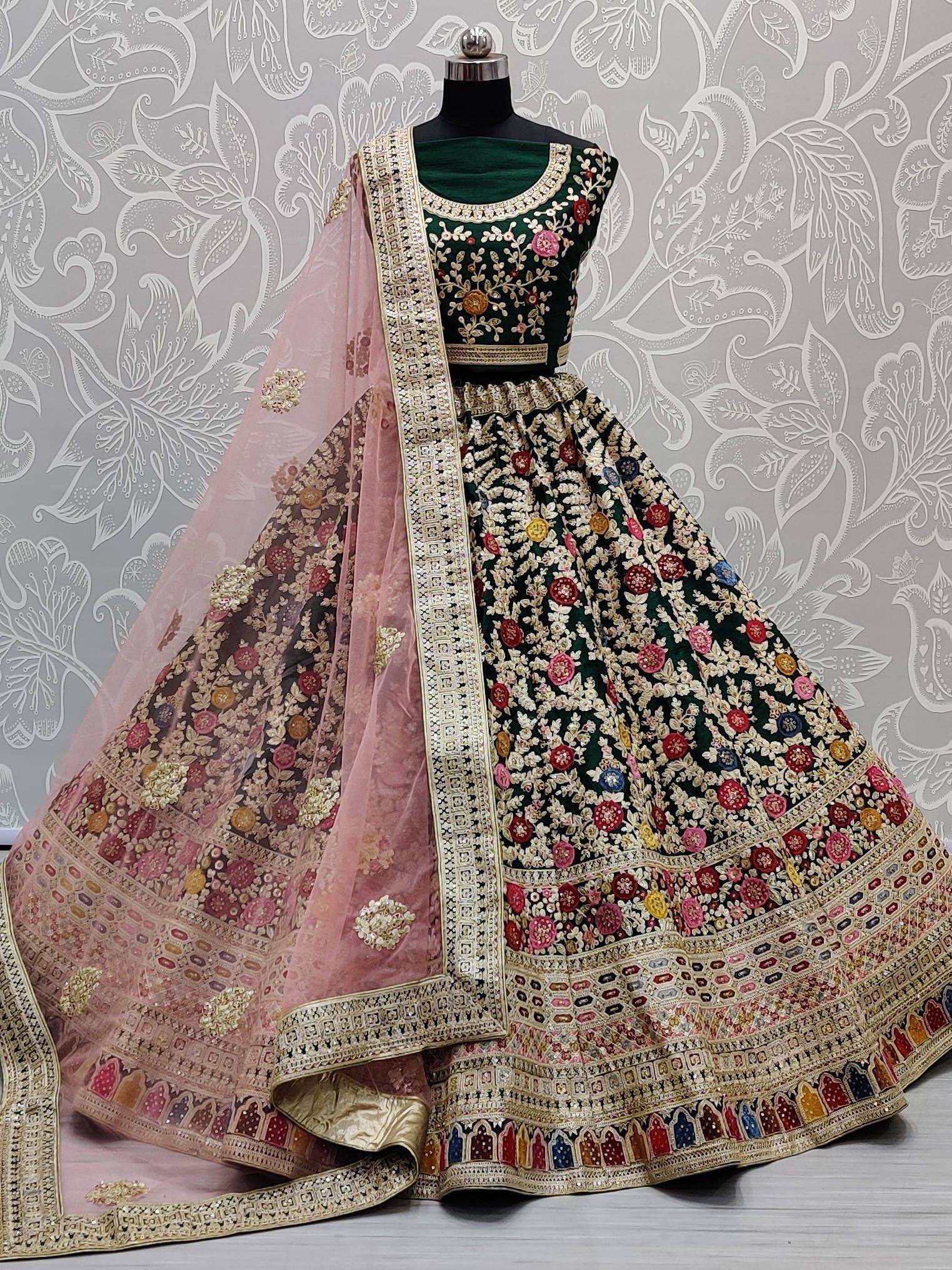 Green and pink embroidered lehenga choli with floral motifs and dupatta, Indian ethnic wear
