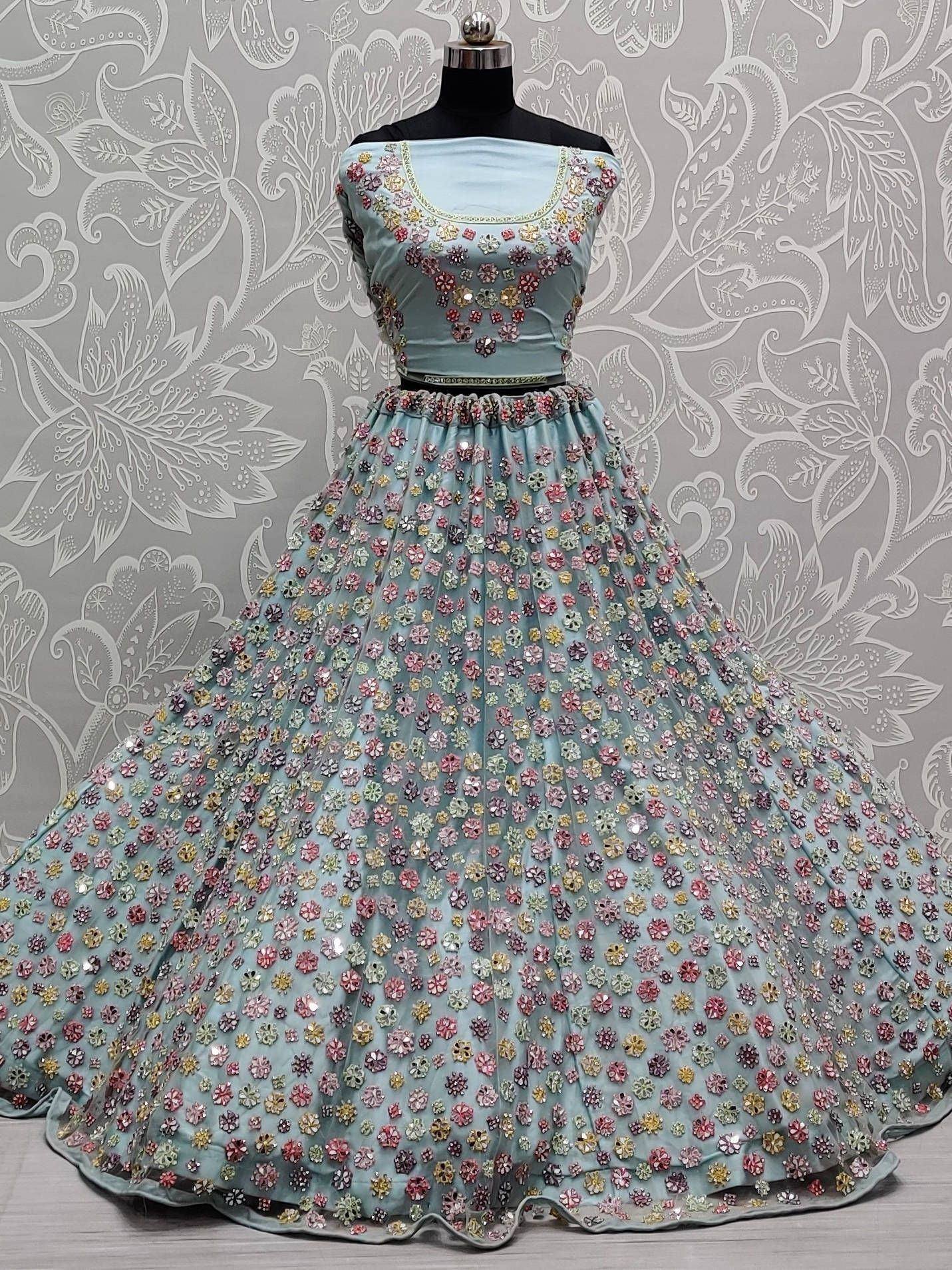 Light blue designer lehenga choli with floral embroidery, perfect for Indian ethnic wear occasions