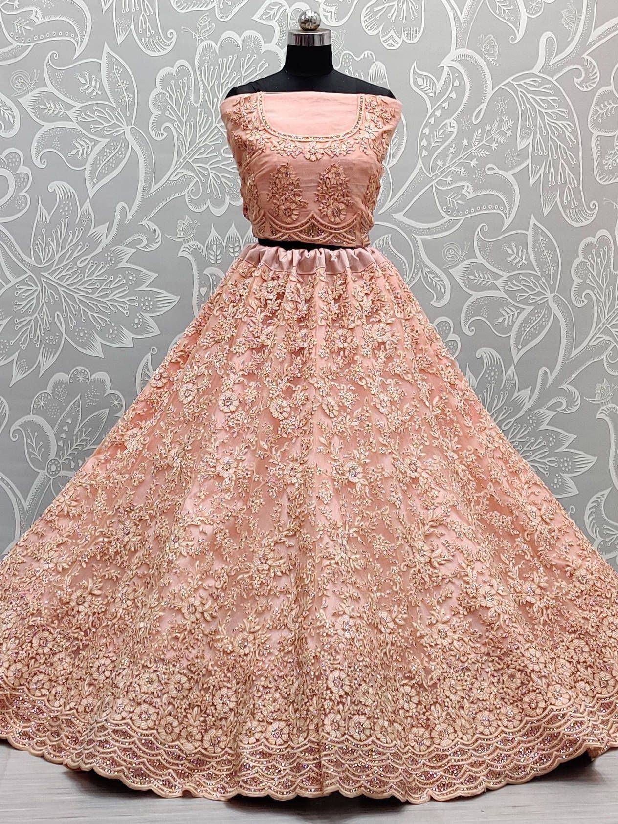 Pink embroidered lehenga choli with floral lace and scalloped hem, perfect for Indian ethnic occasions