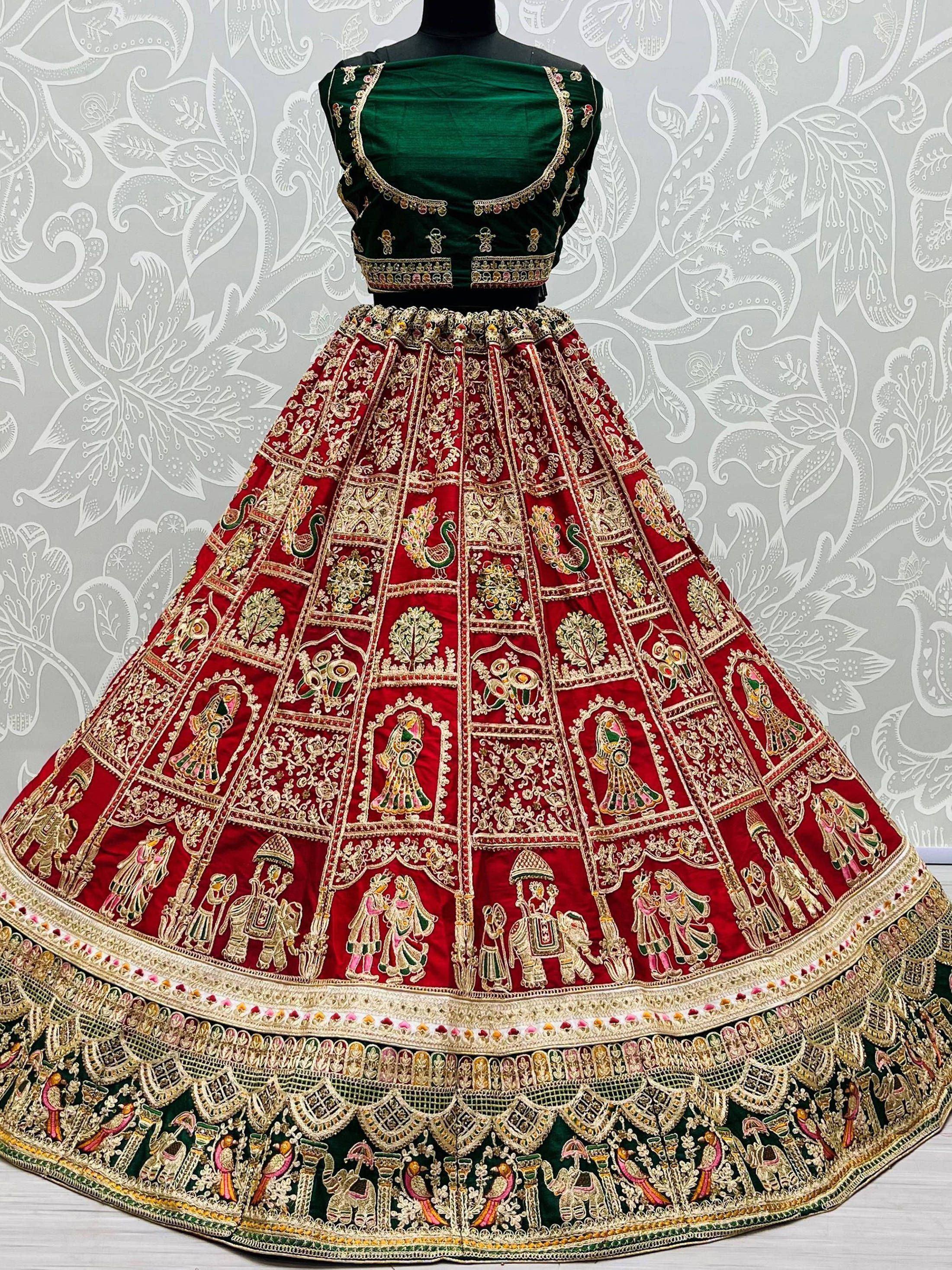 Red and green embroidered lehenga choli with peacock and elephant motifs, traditional Indian ethnic wear