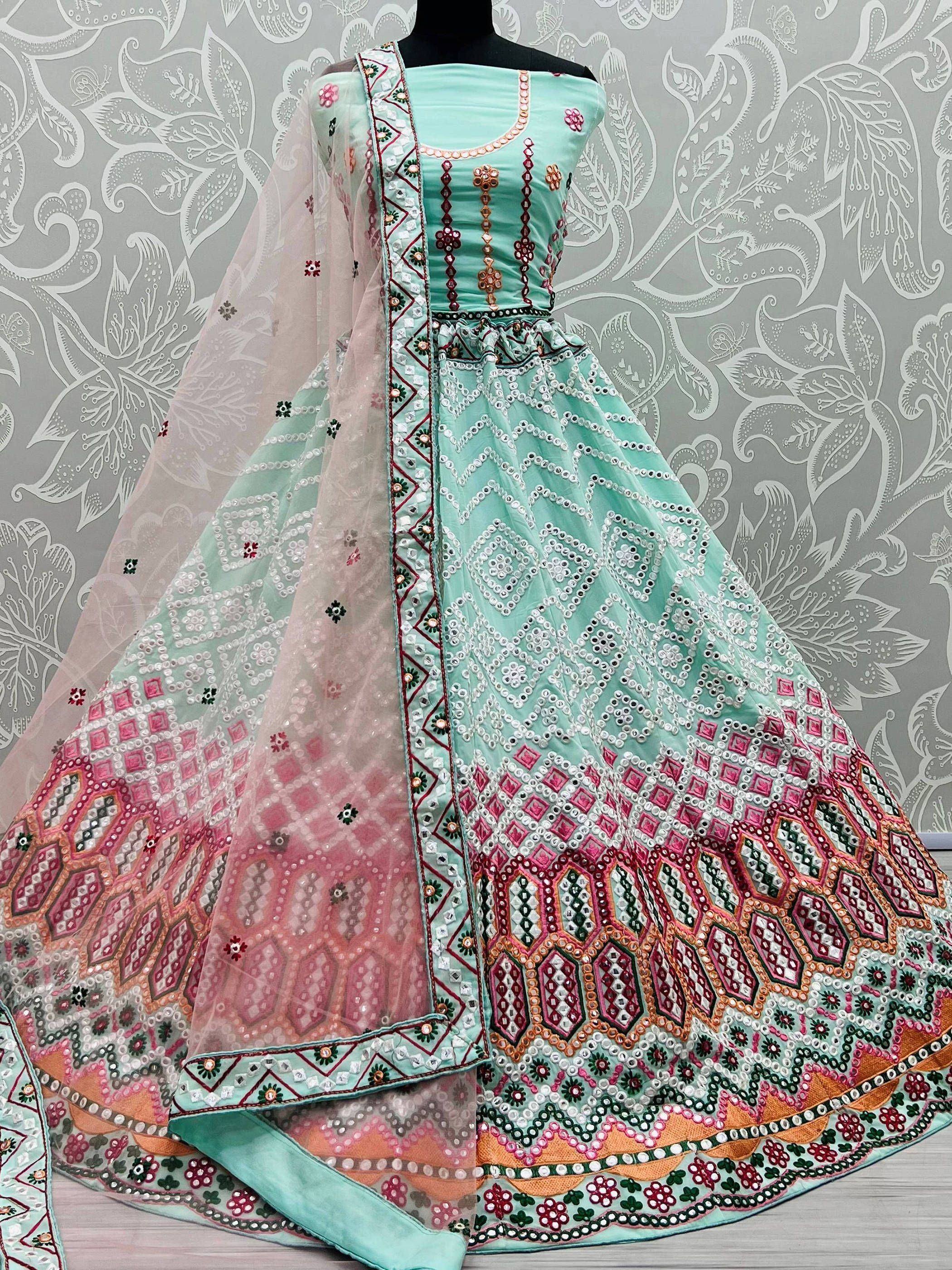 Mint green designer lehenga choli with mirror work, pink border, and sheer dupatta for Indian ethnic wear