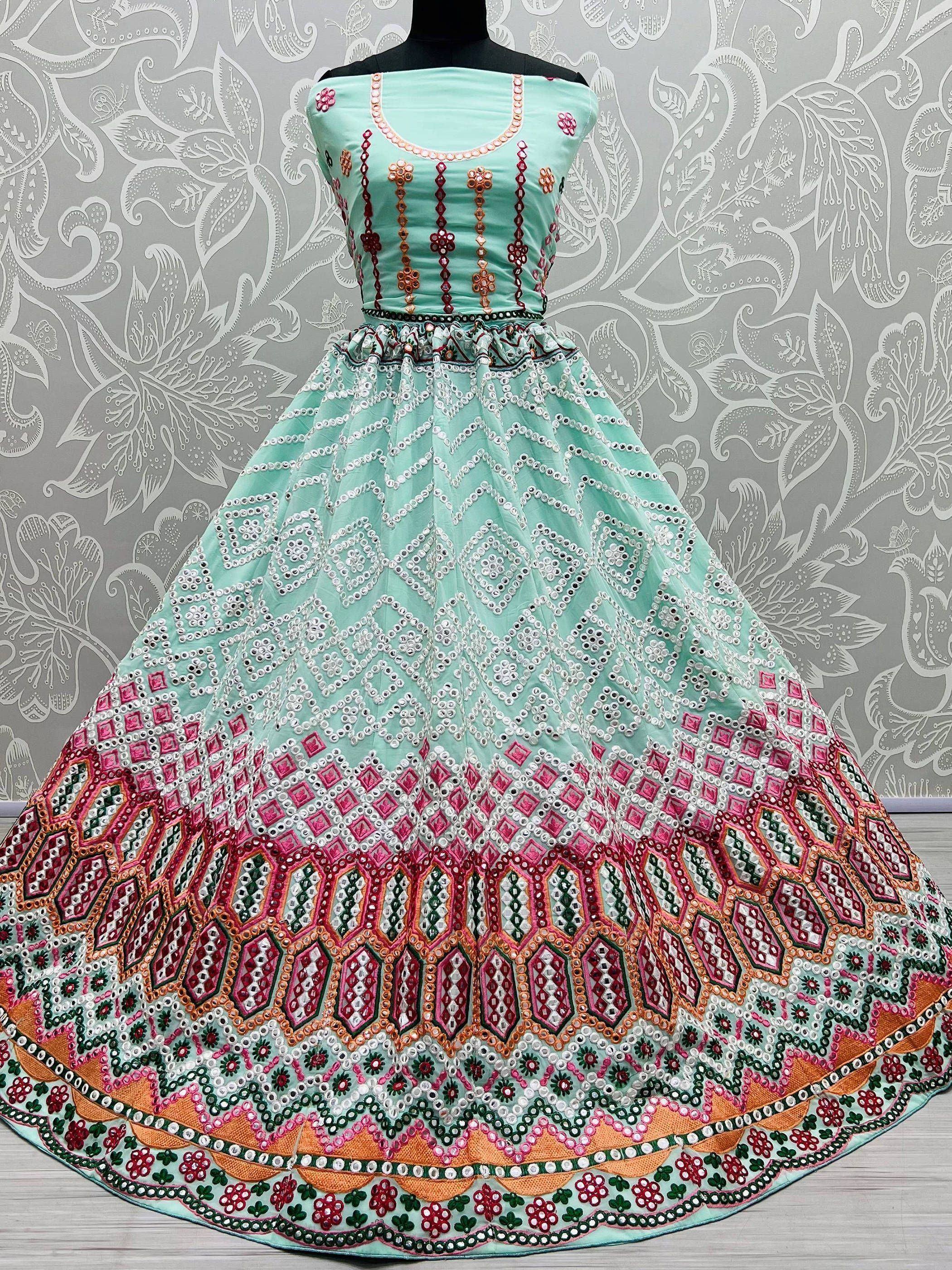 Mint green ethnic gown with mirror work and floral embroidery, perfect for Indian celebrations
