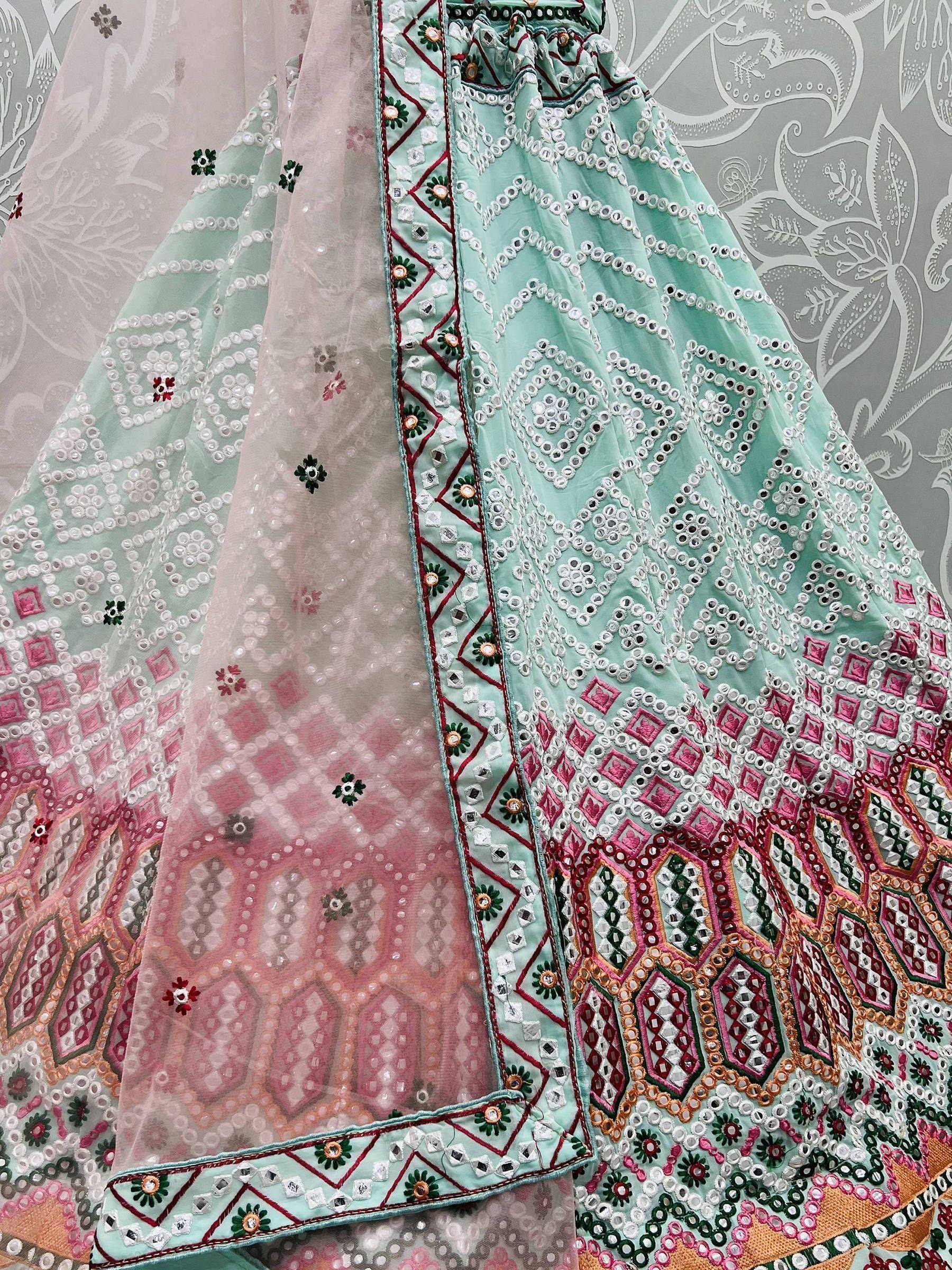 Mint green designer lehenga choli with mirror work, floral embroidery, and pink border detailing