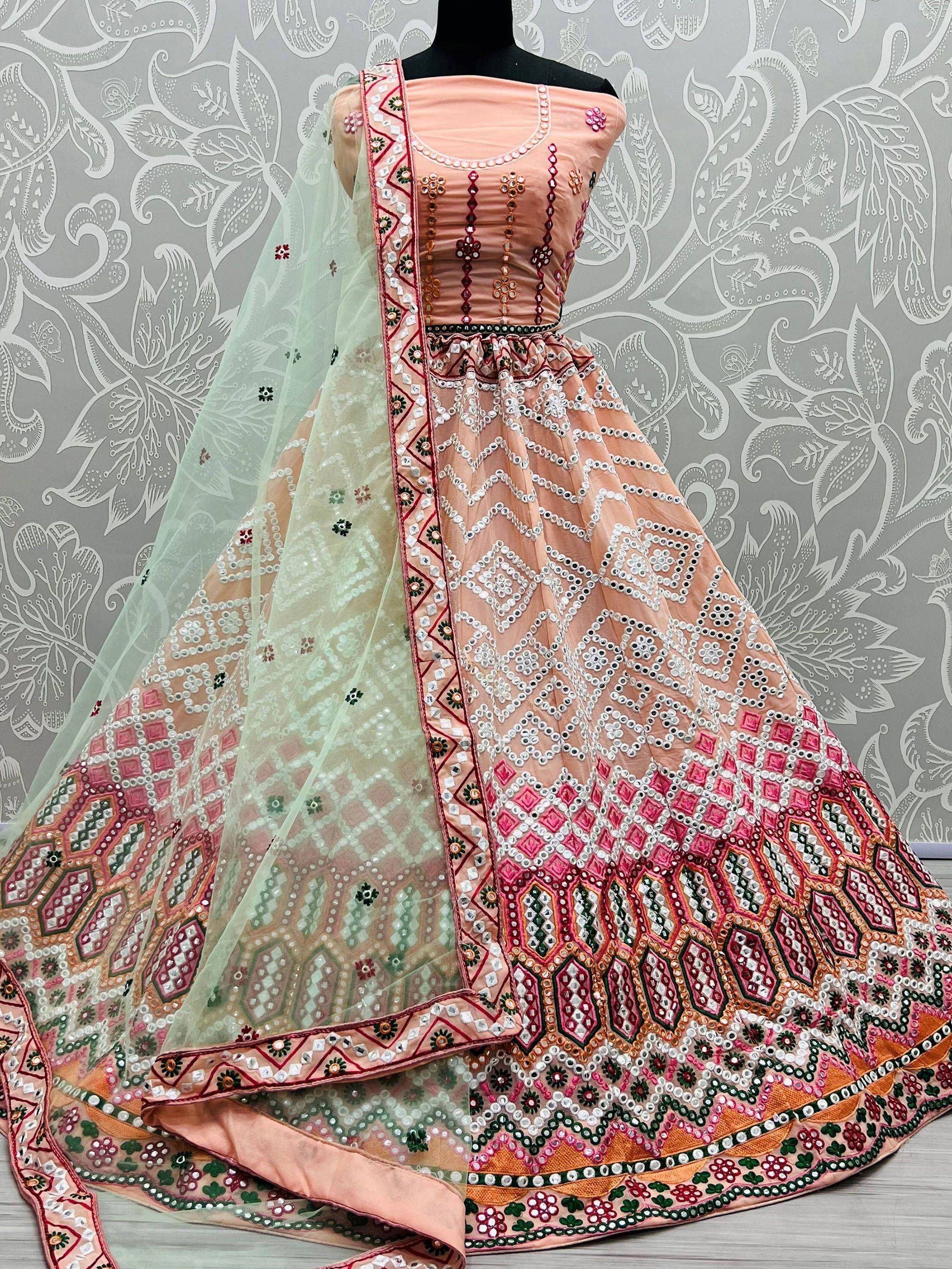 Peach designer lehenga choli with mirror work and green dupatta, ethnic Indian wear