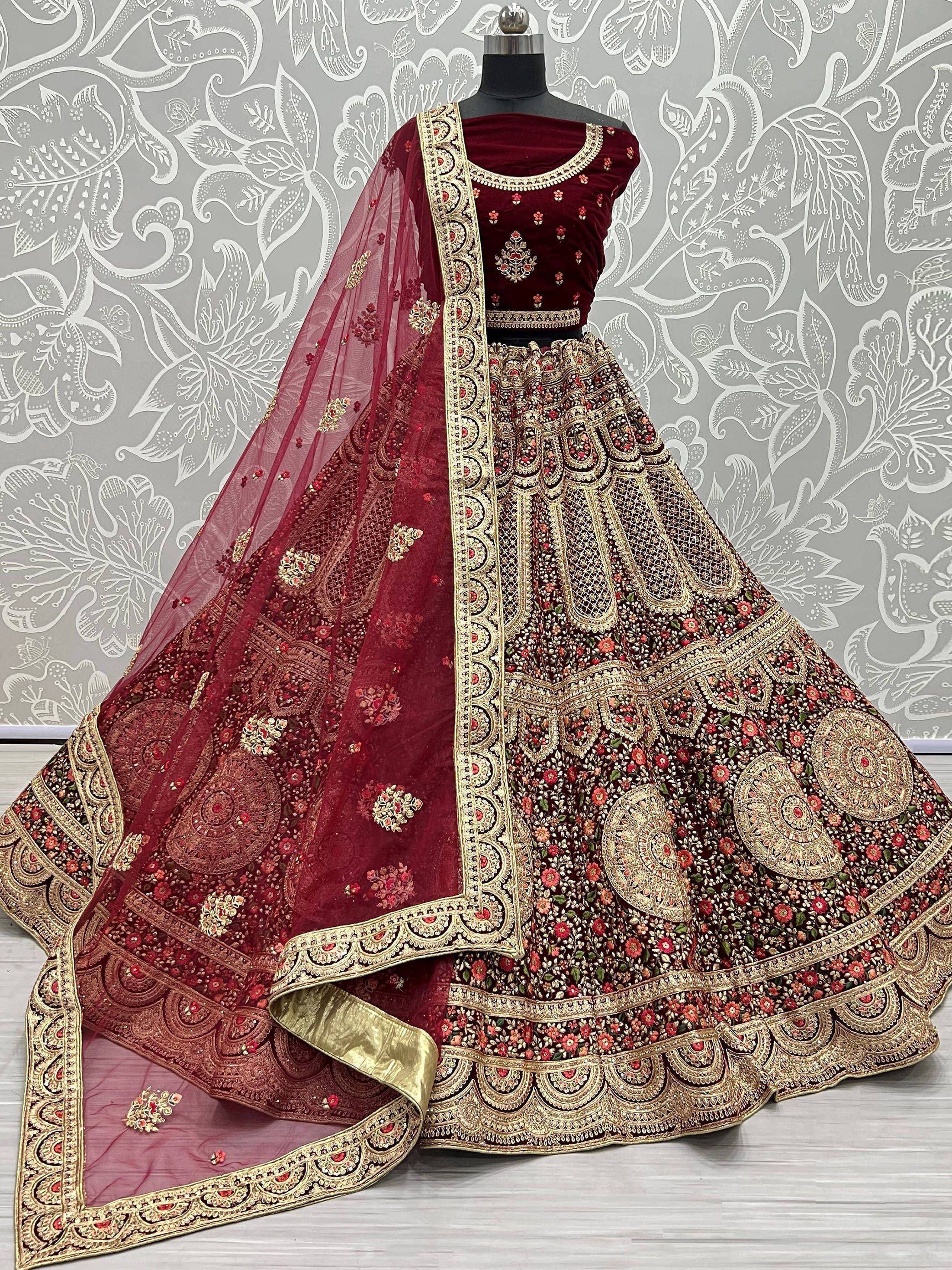 Maroon velvet designer lehenga choli with heavy gold embroidery and floral net dupatta, Indian ethnic wear