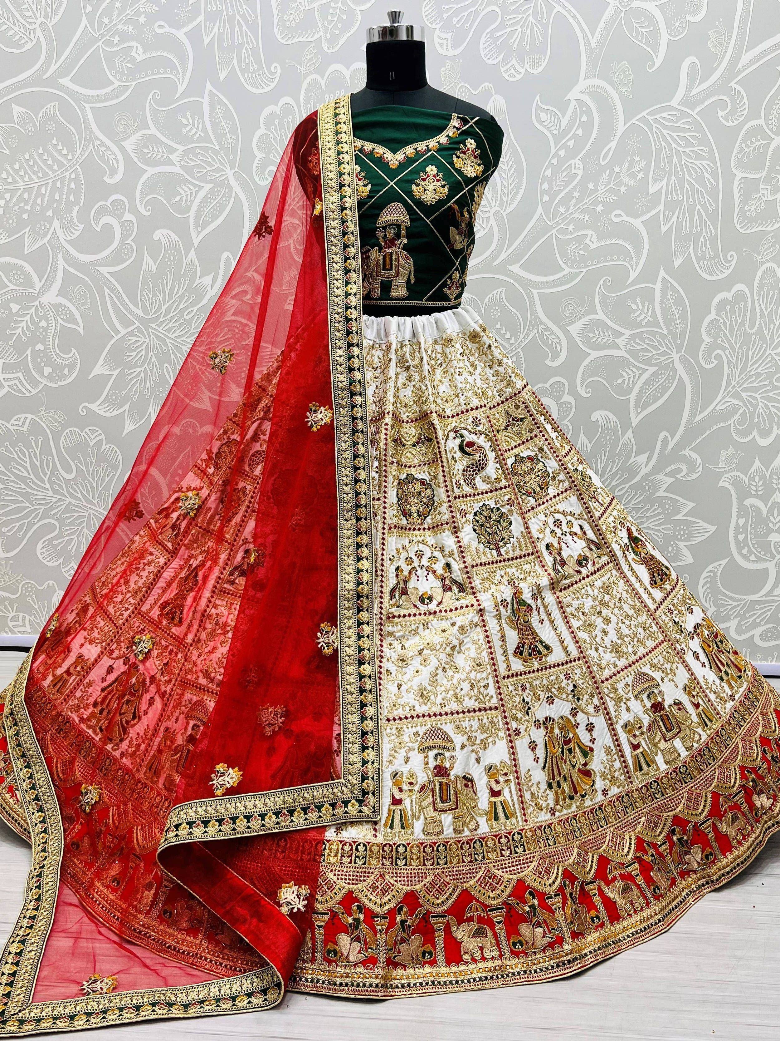 Designer lehenga choli with green velvet blouse, embroidered white skirt, and red dupatta, perfect for Indian weddings.