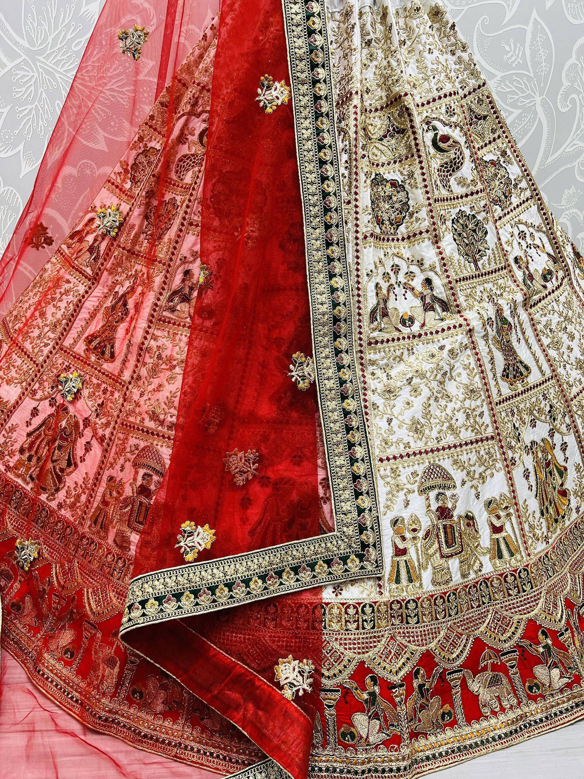 Designer lehenga choli with intricate gold embroidery, red velvet, and traditional Indian motifs for festive occasions.