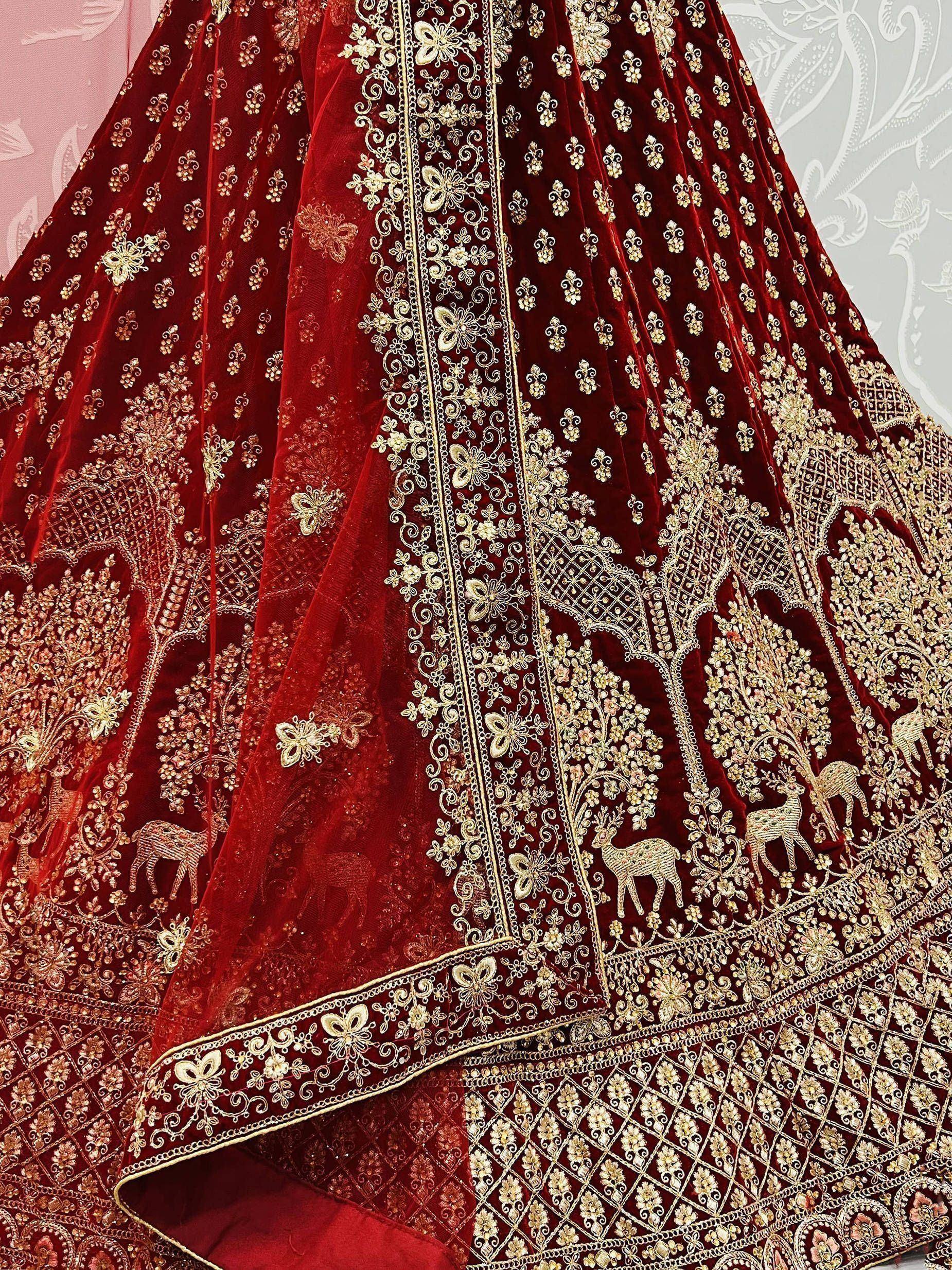 Luxury red velvet lehenga with gold deer and floral embroidery, Indian ethnic wear