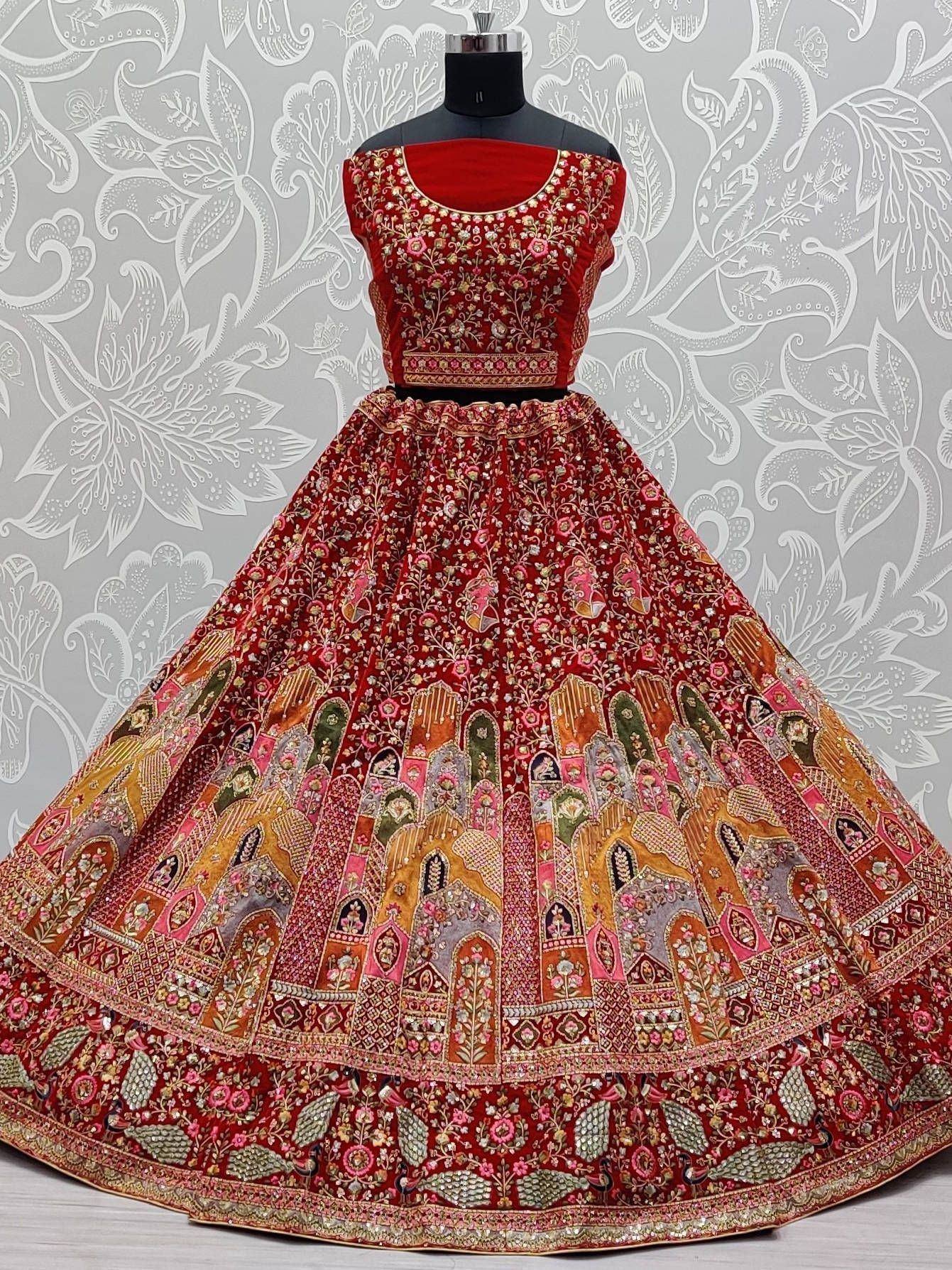 Red embroidered lehenga choli with palace motifs, perfect for Indian weddings and festive occasions