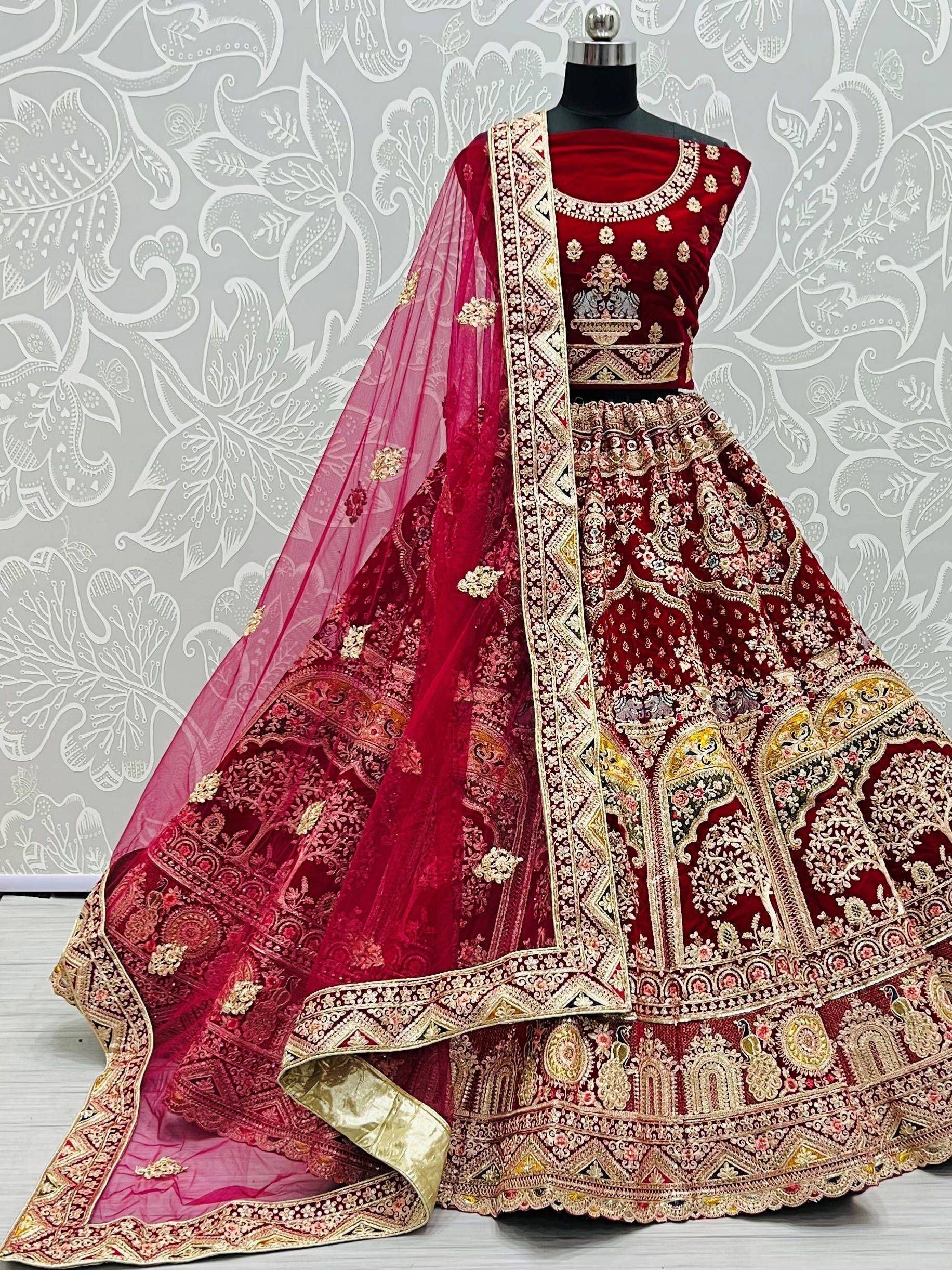 Red velvet designer lehenga choli with heavy gold embroidery and matching dupatta, perfect for weddings