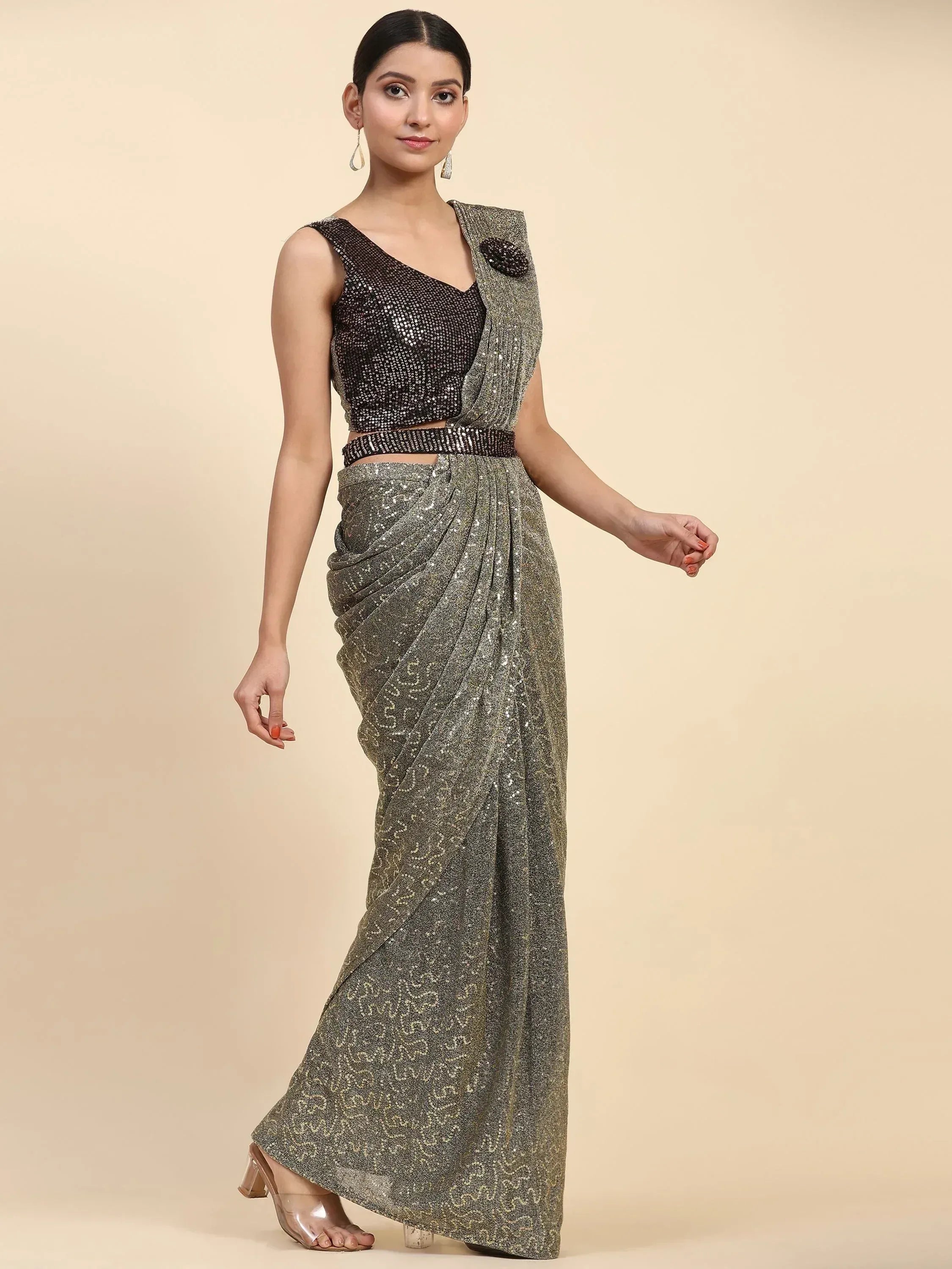 Glittering gold sequin saree with black embellished blouse, perfect for Indian ethnic events and parties