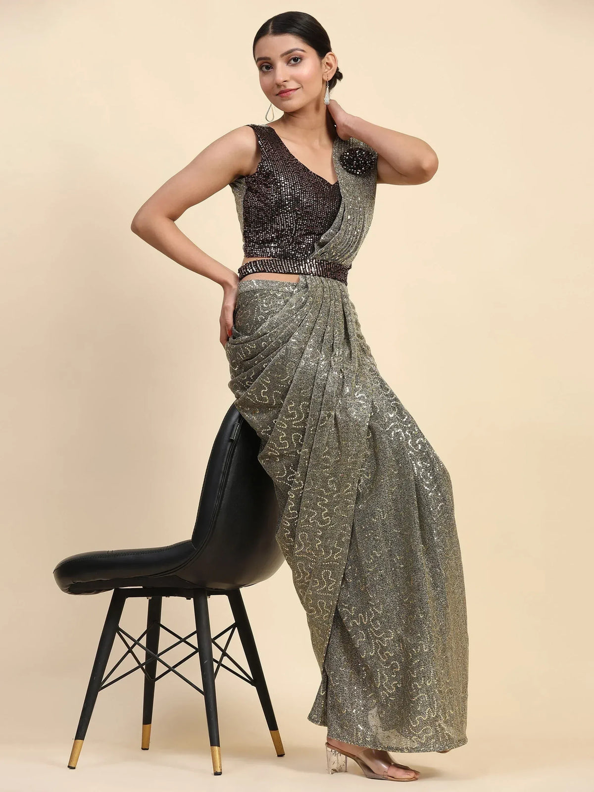 Glittering gold sequin drape saree with matching crop top, perfect for Indian ethnic events and parties.