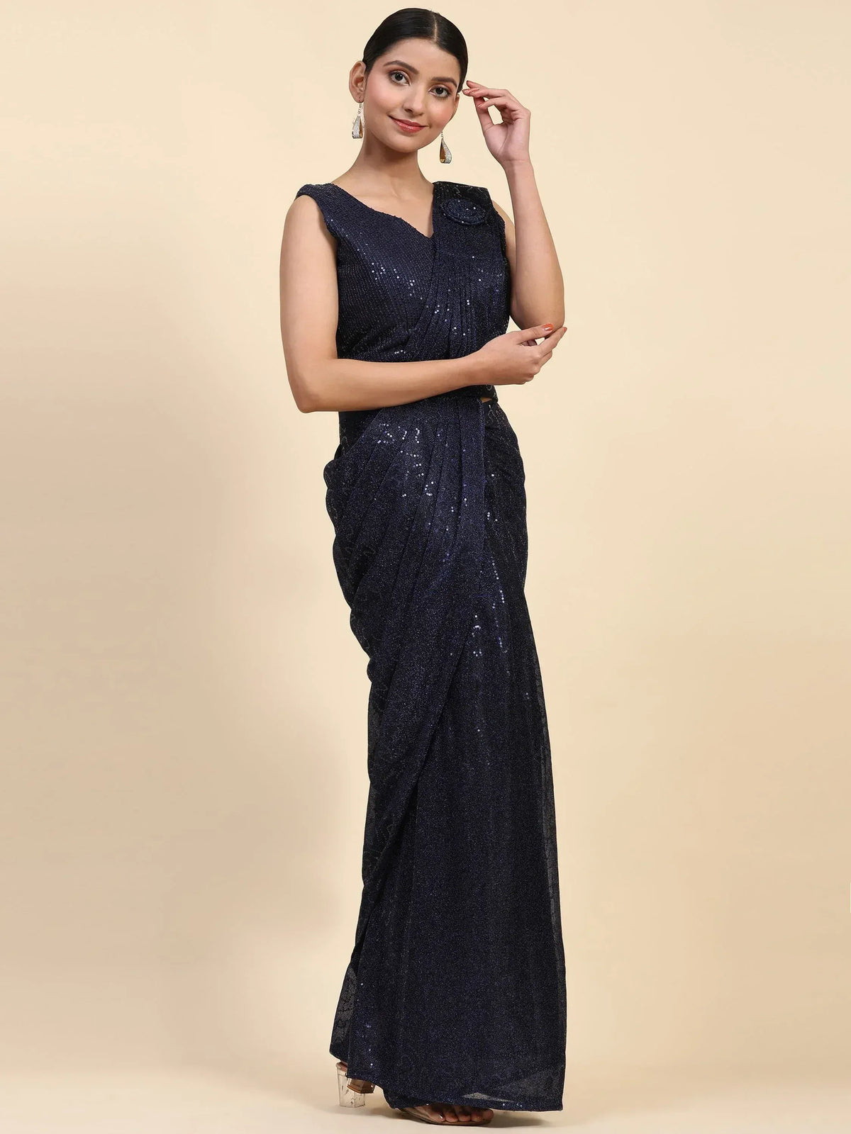 Navy blue sequin saree gown with sleeveless V-neck top, perfect for Indian ethnic events and parties.