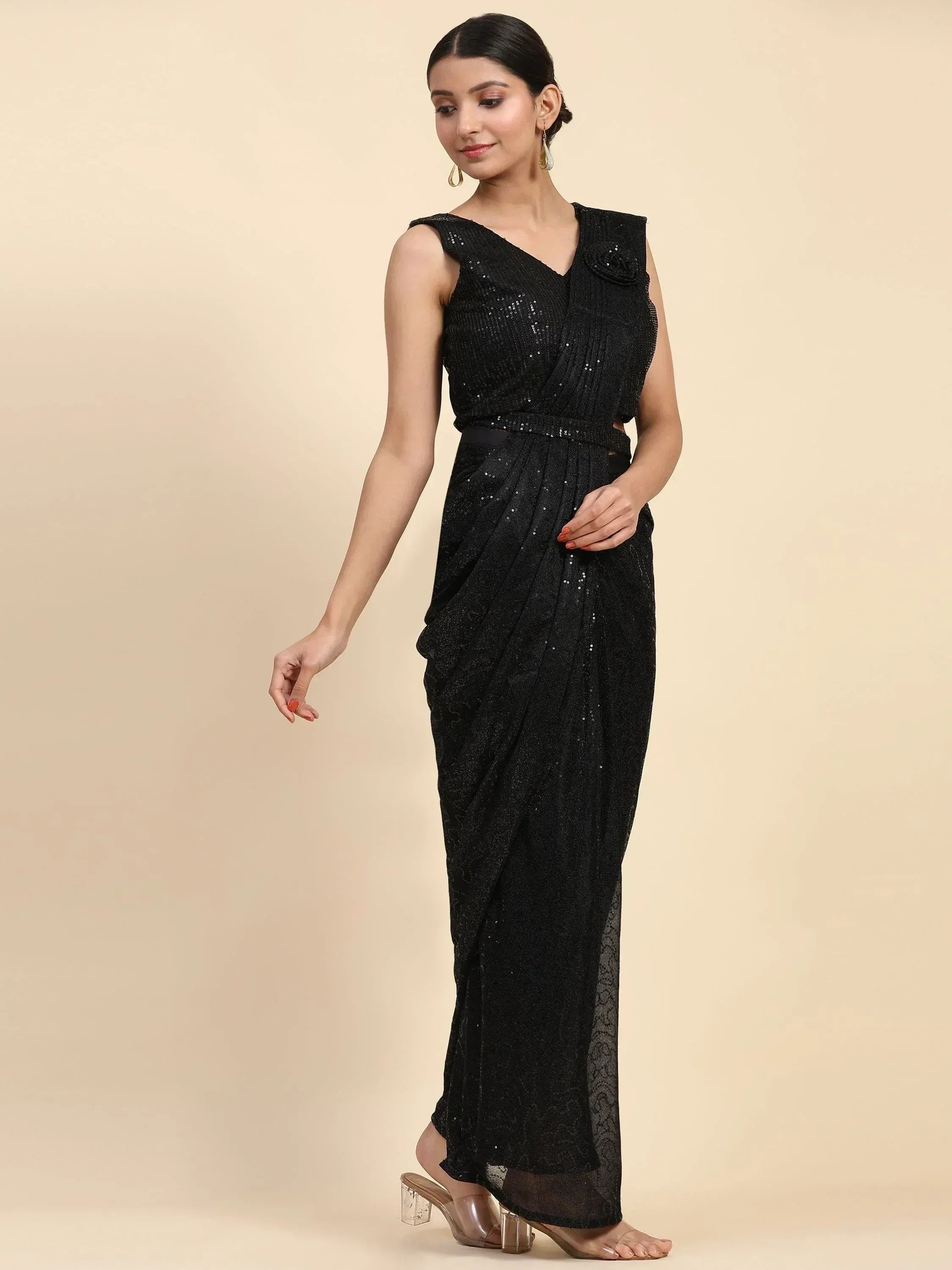 Black sequin saree gown with V-neck and side drape, perfect for ethnic events and parties.