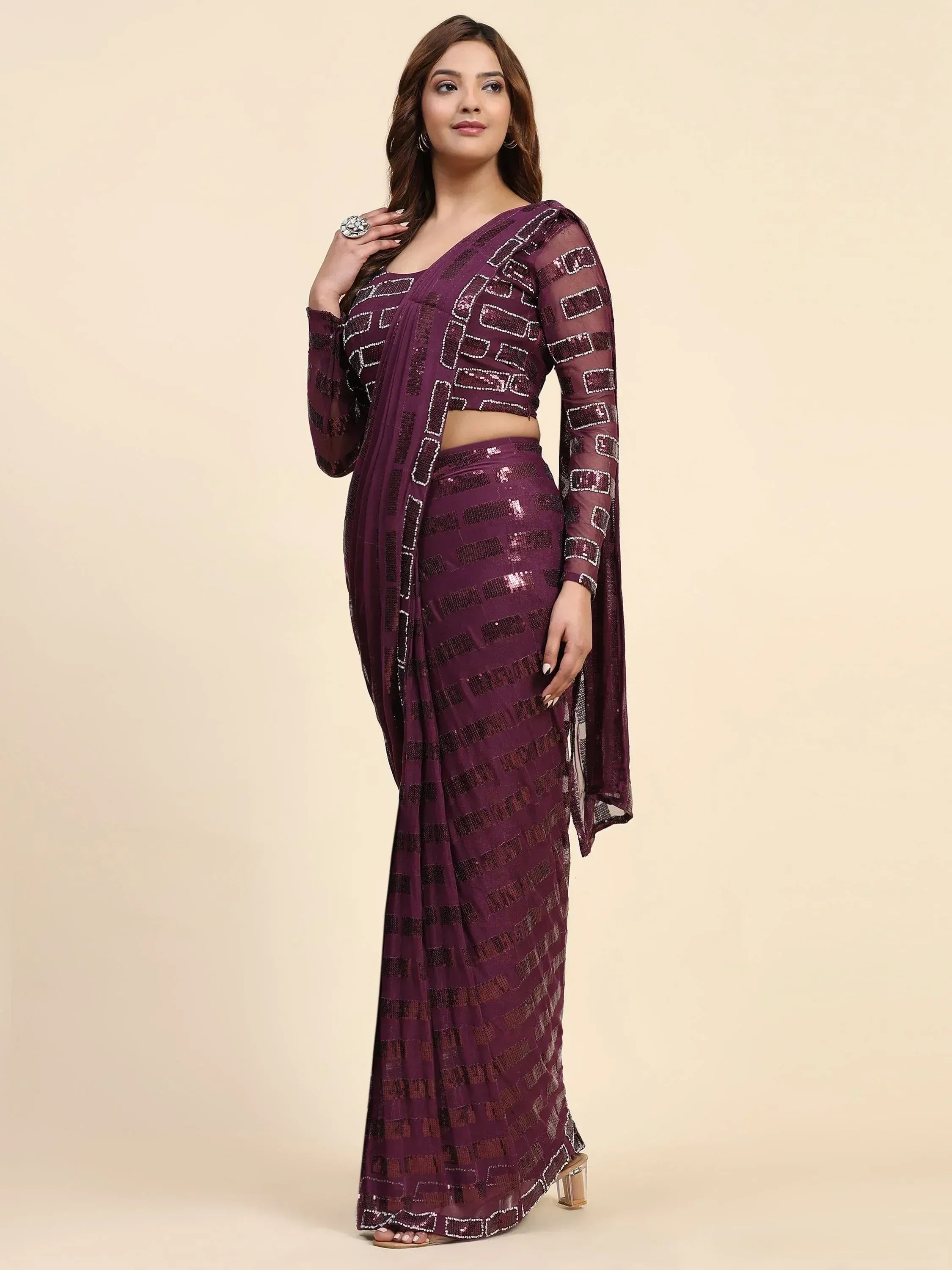 Purple sequin saree with geometric pattern, long sleeves, and crop top for Indian ethnic wear
