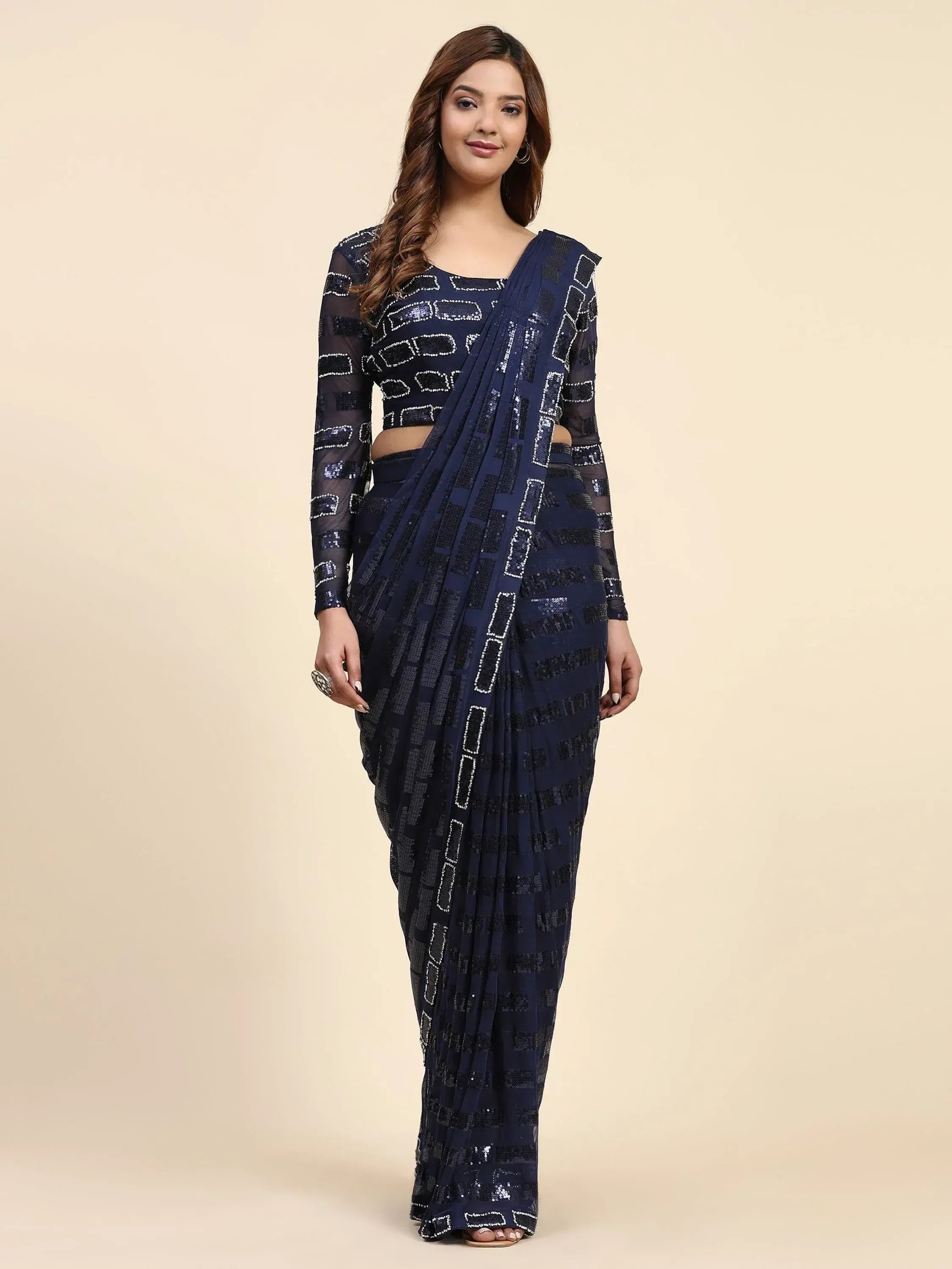 Navy blue sequin saree with geometric pattern, paired with matching blouse for ethnic wear