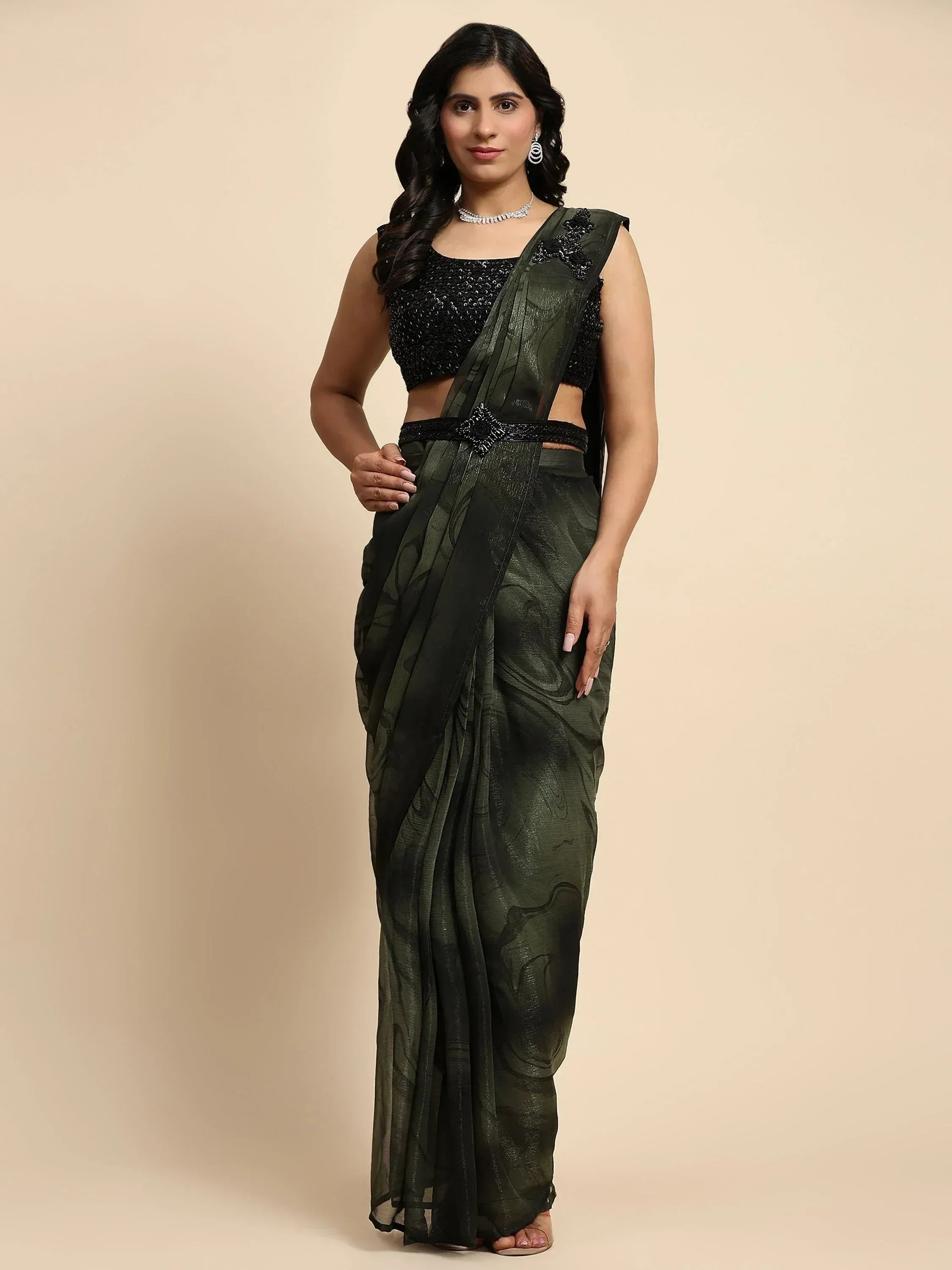 Elegant dark green saree with black sequin blouse, perfect for Indian ethnic occasions and festive wear.