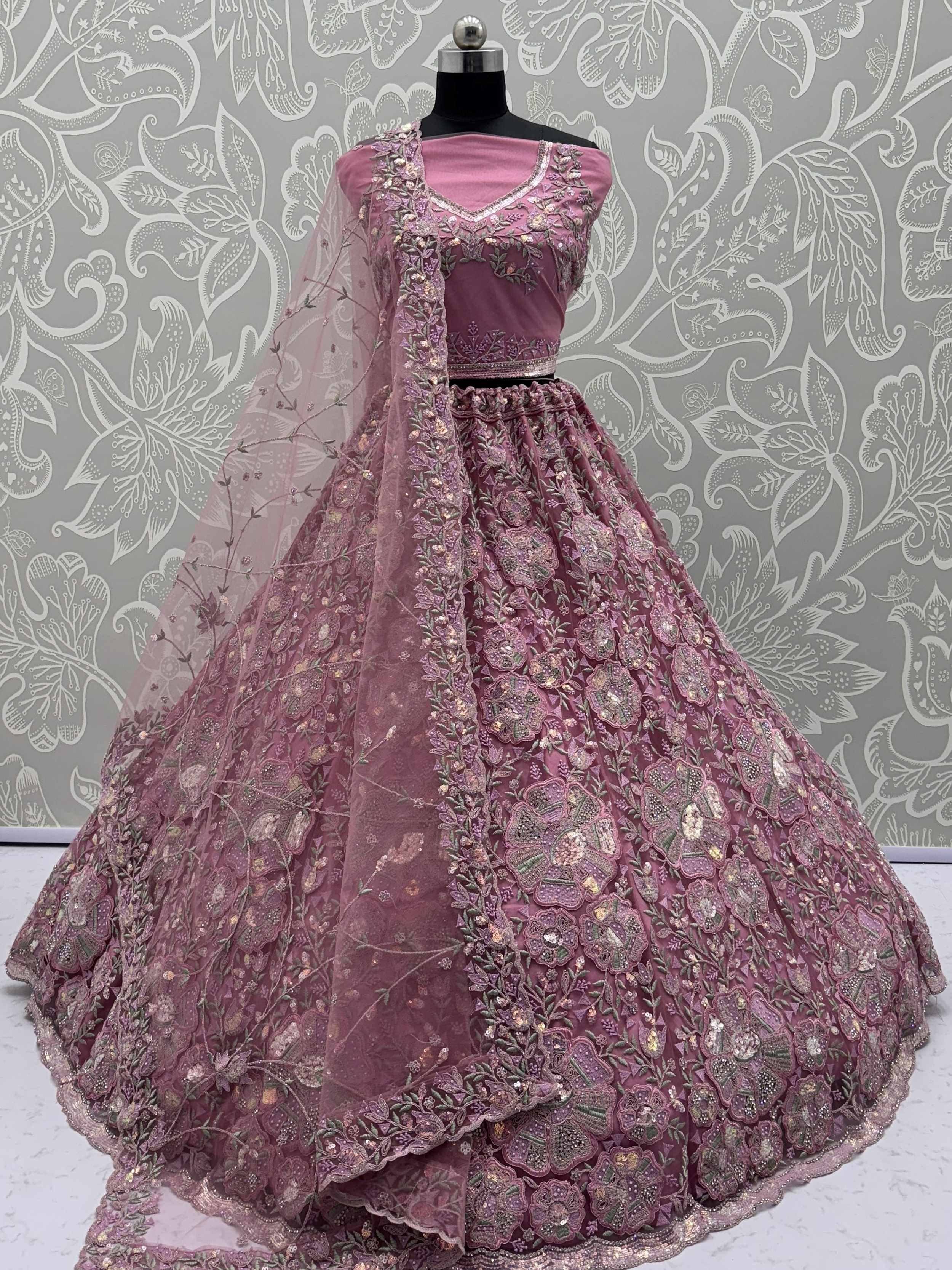 Pink embroidered lehenga choli with floral motifs and sheer dupatta, Indian ethnic wear