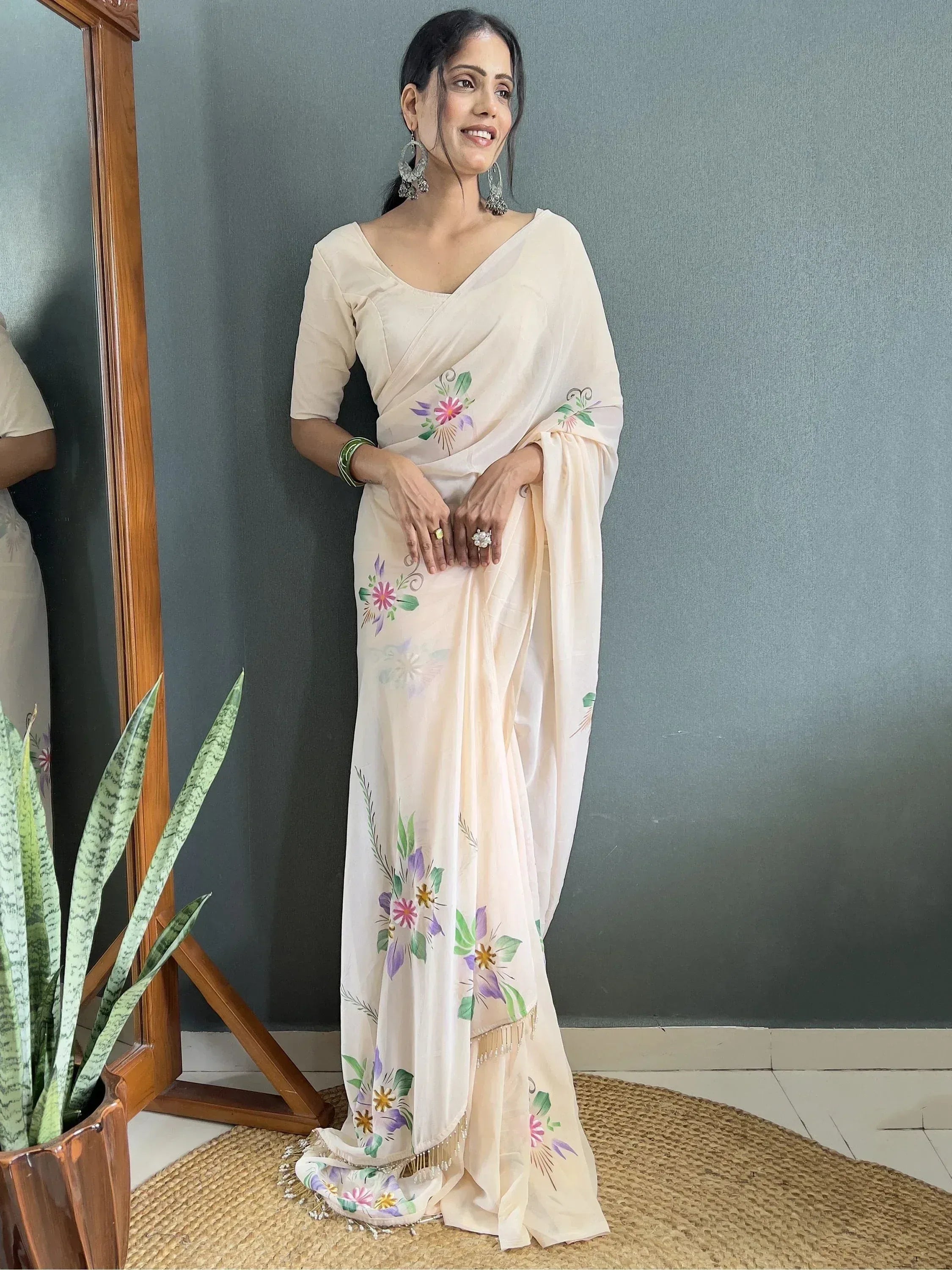 Cream floral printed saree with embroidered details, perfect for Indian ethnic wear occasions