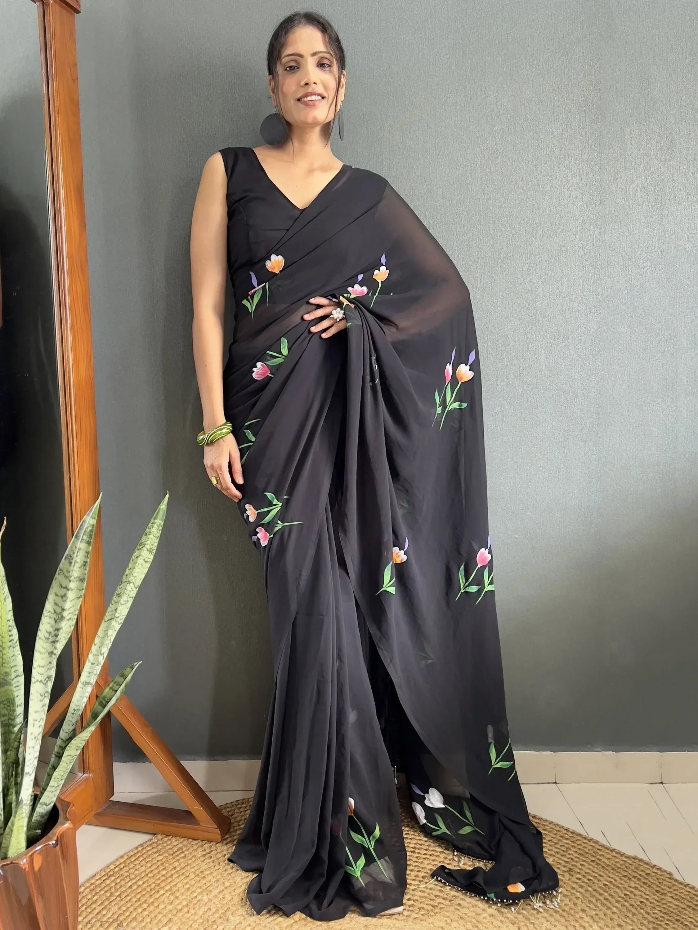 Black floral print saree with sleeveless blouse, Indian ethnic wear for women