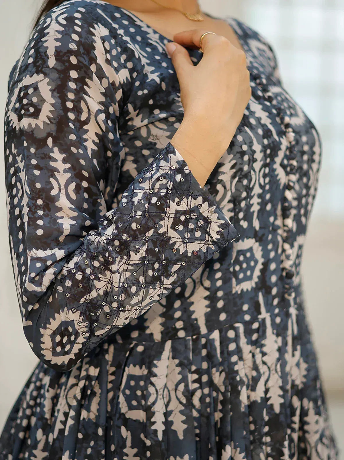 Blue and beige printed ethnic gown with sequin detailing on sleeves, perfect for Indian occasions.