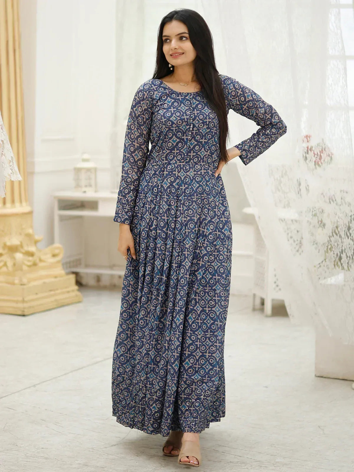 Blue printed ethnic gown with long sleeves and flared skirt, perfect for Indian occasions