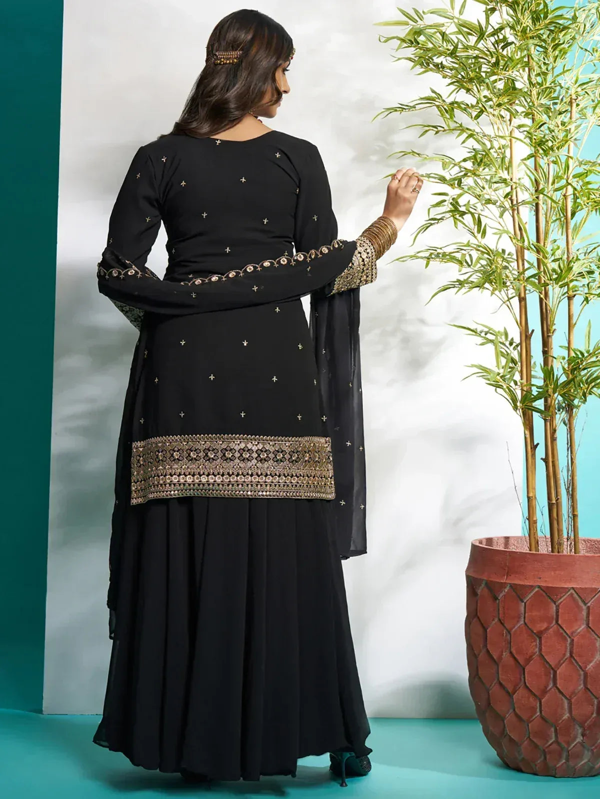 Black embroidered salwar kameez with gold detailing, stylish ethnic wear for women