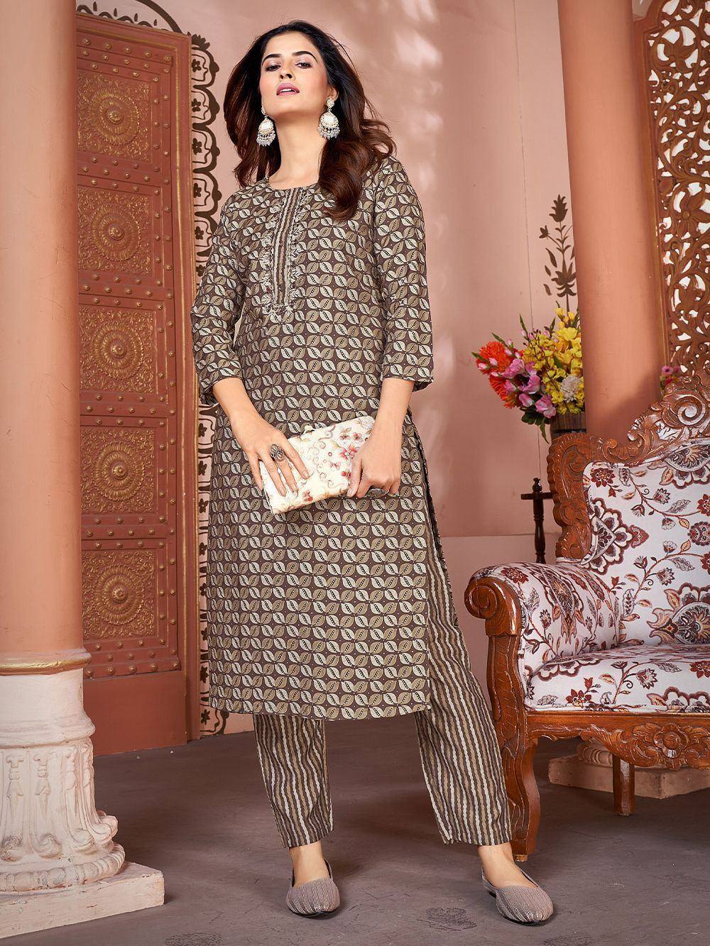 Woman in printed ethnic kurta with striped palazzo pants, perfect for Indian occasions