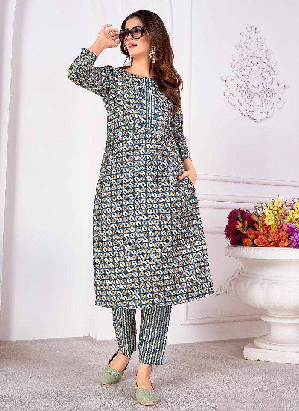 Woman in printed kurta with striped pants, stylish ethnic wear for women