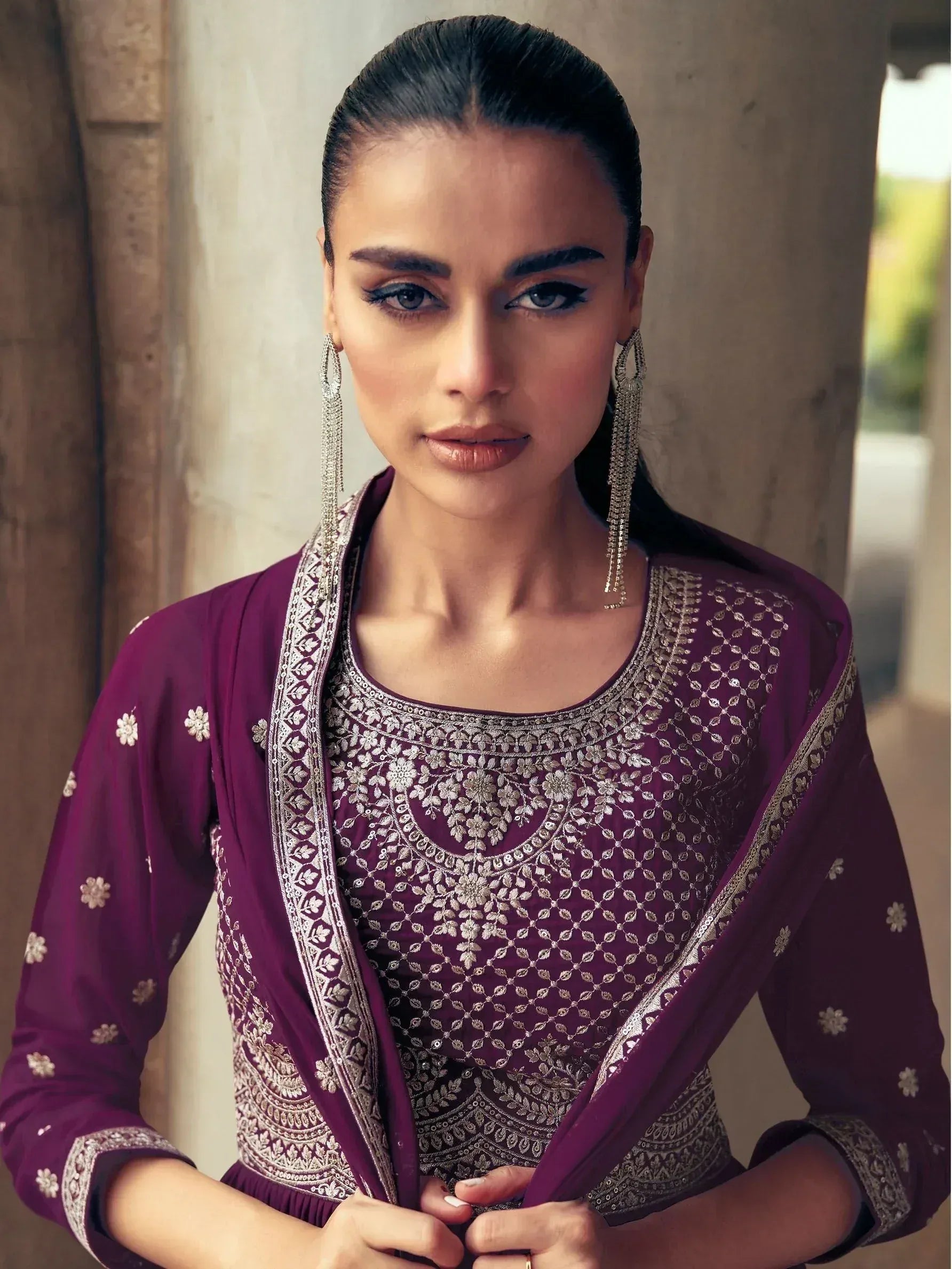 Elegant purple ethnic salwar kameez with silver embroidery and floral detailing, perfect for festive occasions.