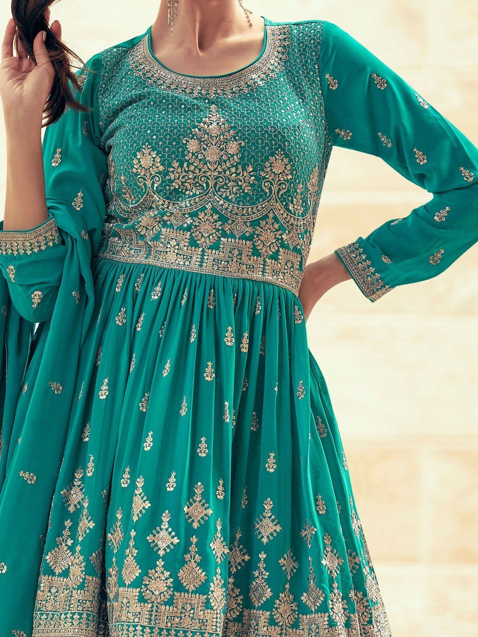 Emerald green embroidered anarkali suit with gold zari work, perfect for Indian ethnic wear occasions.